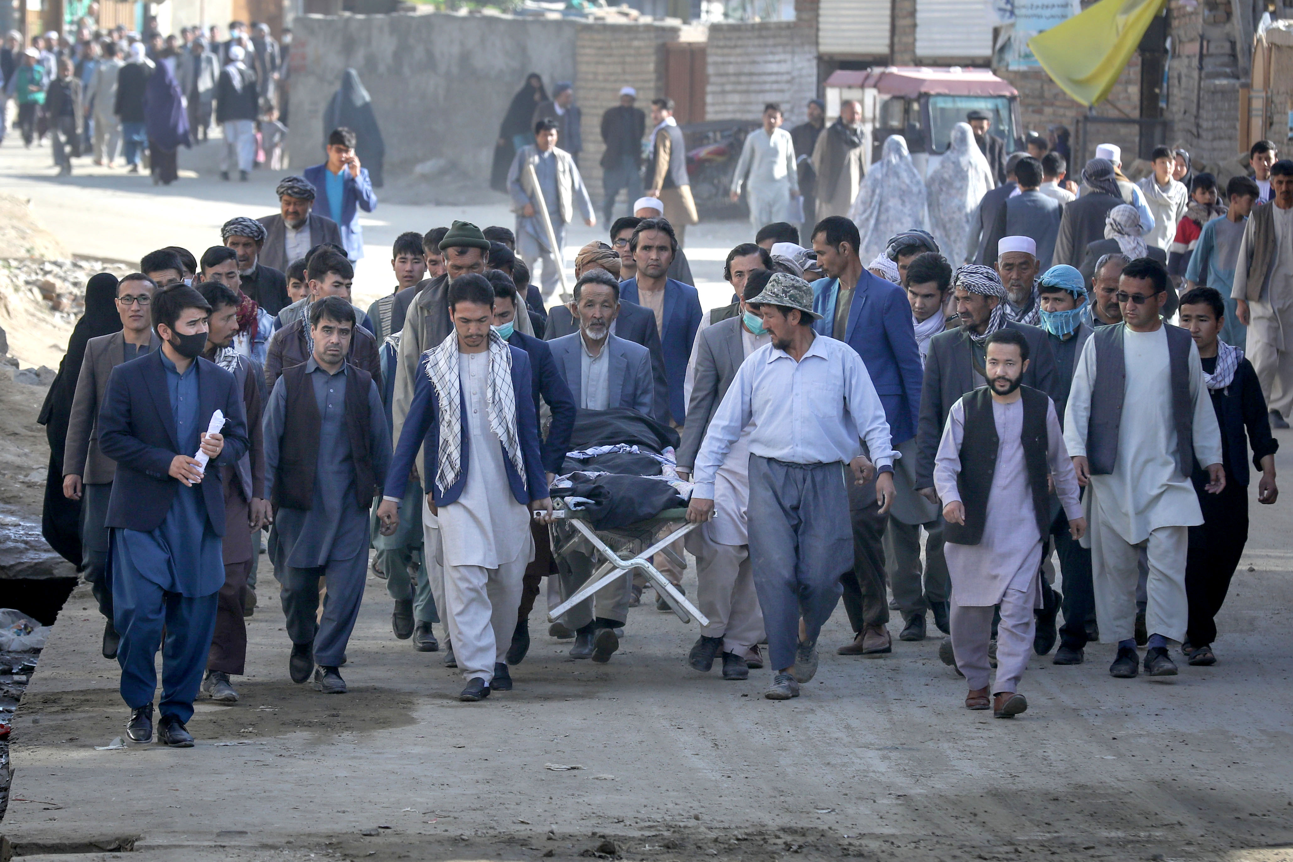 People attend the funeral of one of the victims of an attack that targeted a school in Dasht-e-Barchi [File: Hedayatullah Amid/EPA]