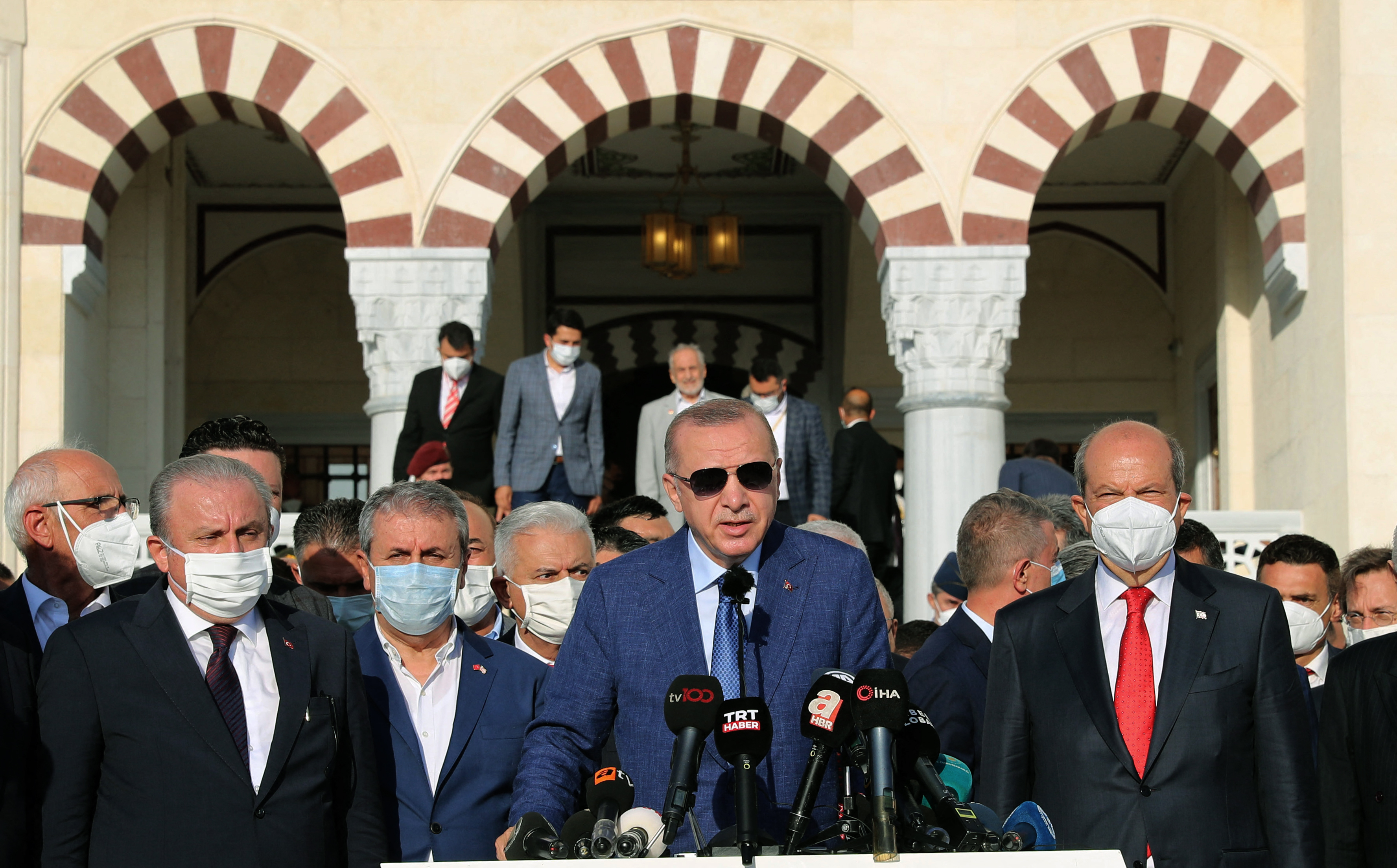 Erdogan, centre, says Turkish forces could run and guard Kabul airport after other foreign troops withdraw from Afghanistan, but the Taliban has warned Turkey against it [Turkish Presidential Press Service handout via AFP]