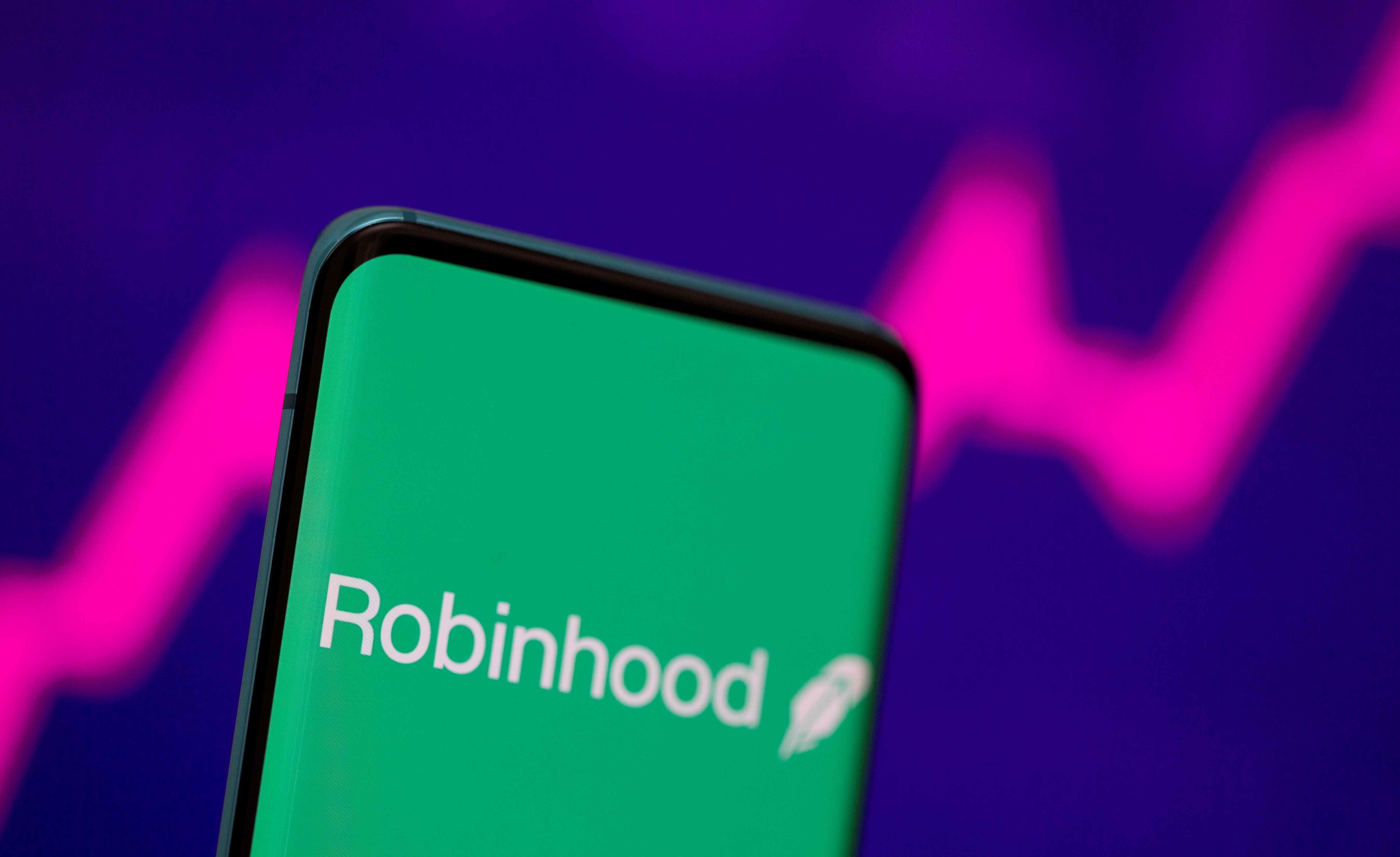 Investment app Robinhood&#39;s stated mission is to &#39;democratize finance for all&#39;, but critics dismiss the lofty ideal as spin [File: Dado Ruvic/Reuters]