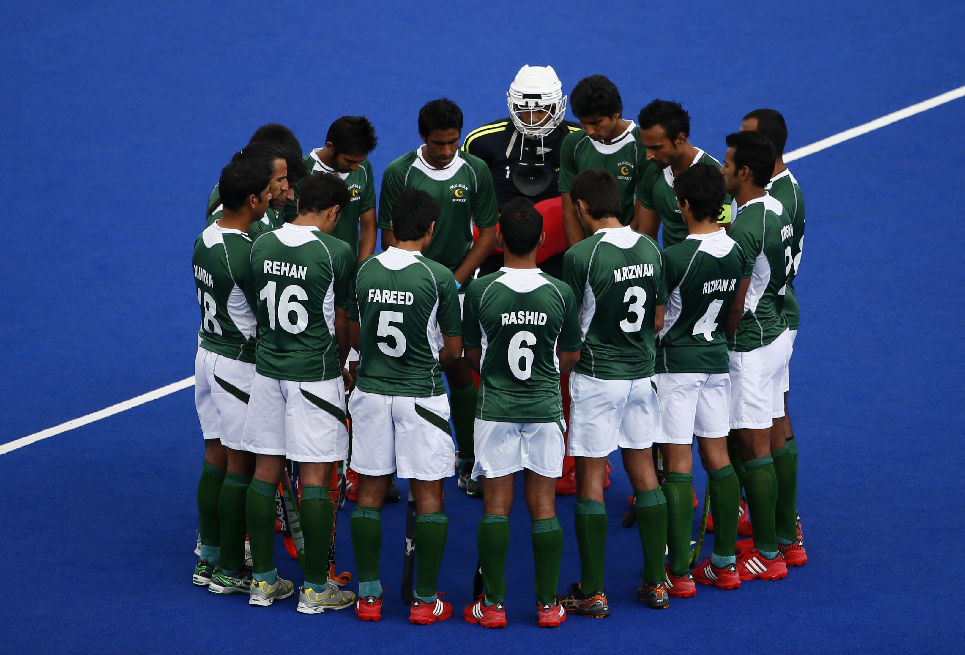 Pakistan's players huddle before a match.