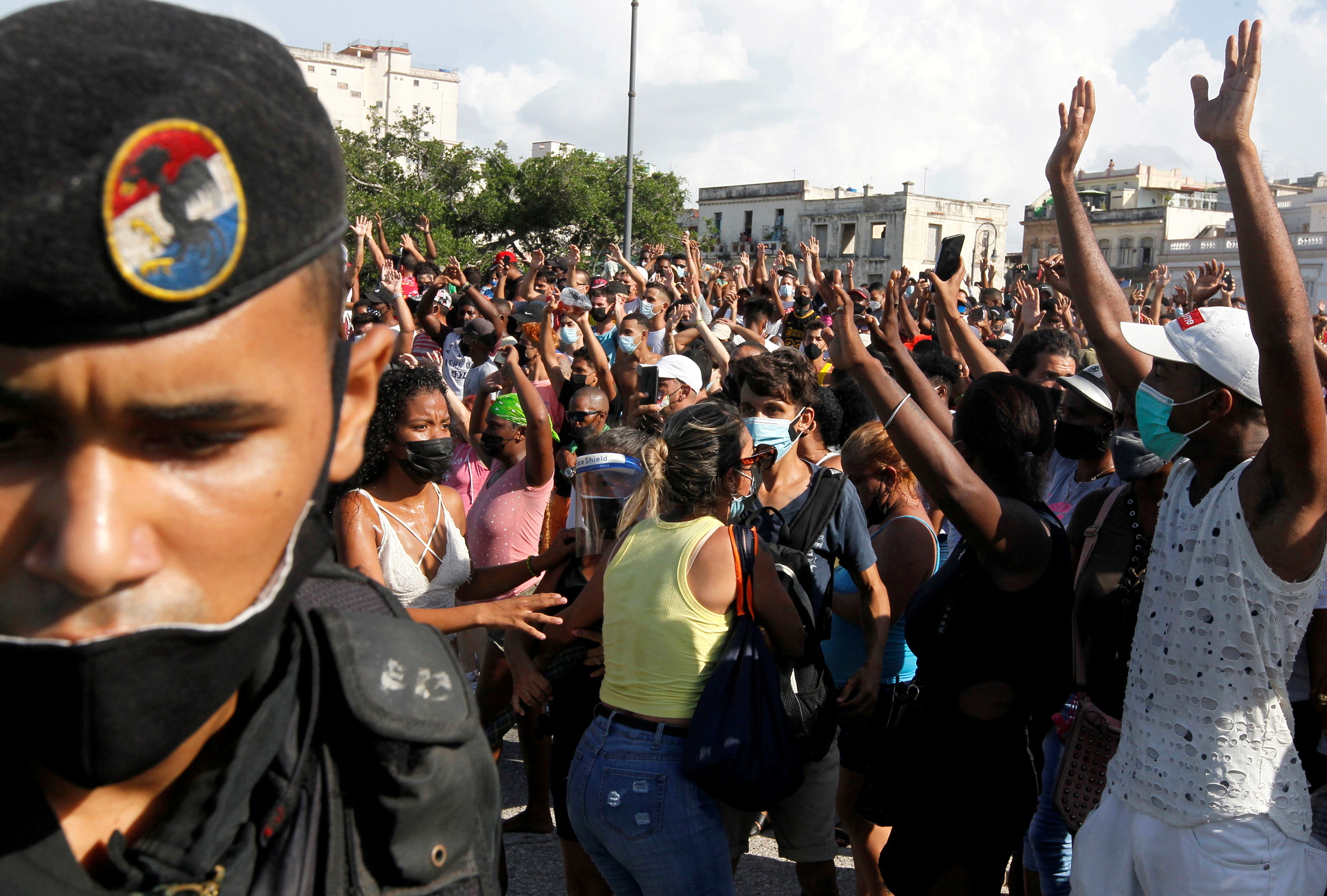 People react during protests against and in support of the Cuban government in Havana on July 11 [File: Stringer/Reuters]