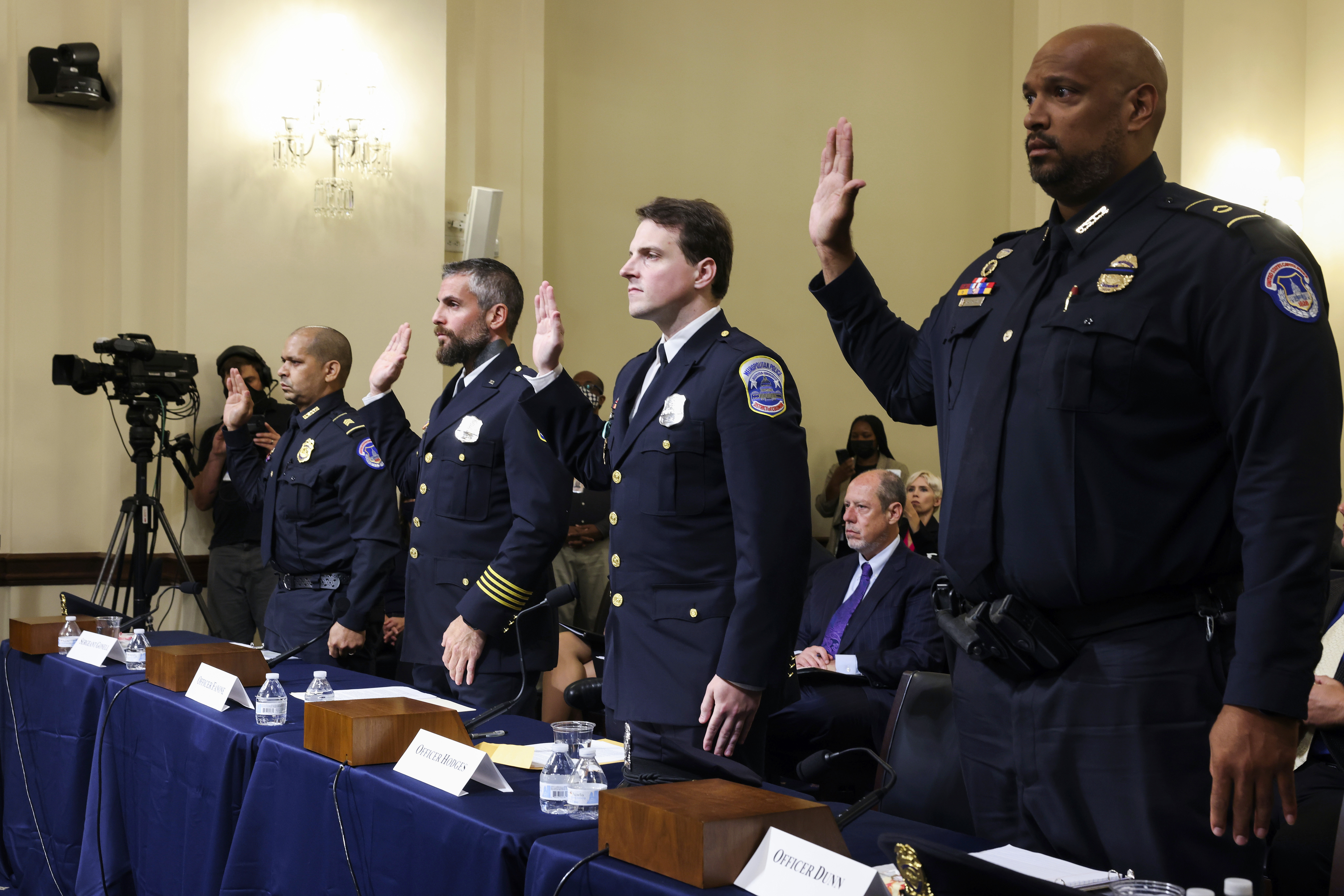 US Capitol Police Sergeant Aquilino Gonell, Washington Metropolitan Police Department officer Michael Fanone, Washington Metropolitan Police Department officer Daniel Hodges and US Capitol Police Sergeant Harry Dunn are sworn in to testify to the House select committee hearing on January 6 breach of the US Capitol. [Jim Lo Scalzo/AP Photo]