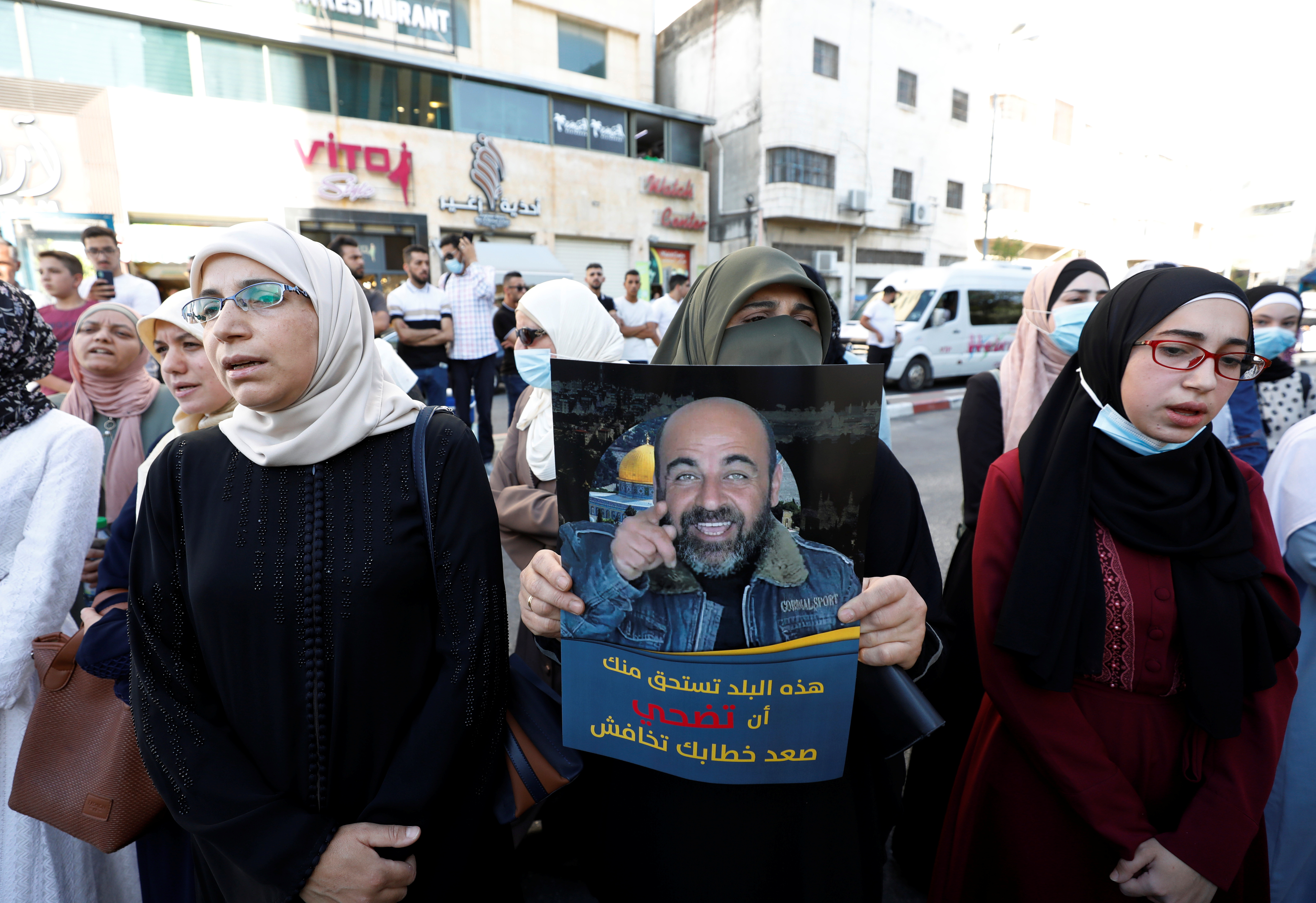 Demonstrators protest against the death of Nizar Banat, a critic of the Palestinian Authority, in Hebron, in the Israeli-occupied West Bank, June 27, 2021 [File: Mussa Qawasma/Reuters]