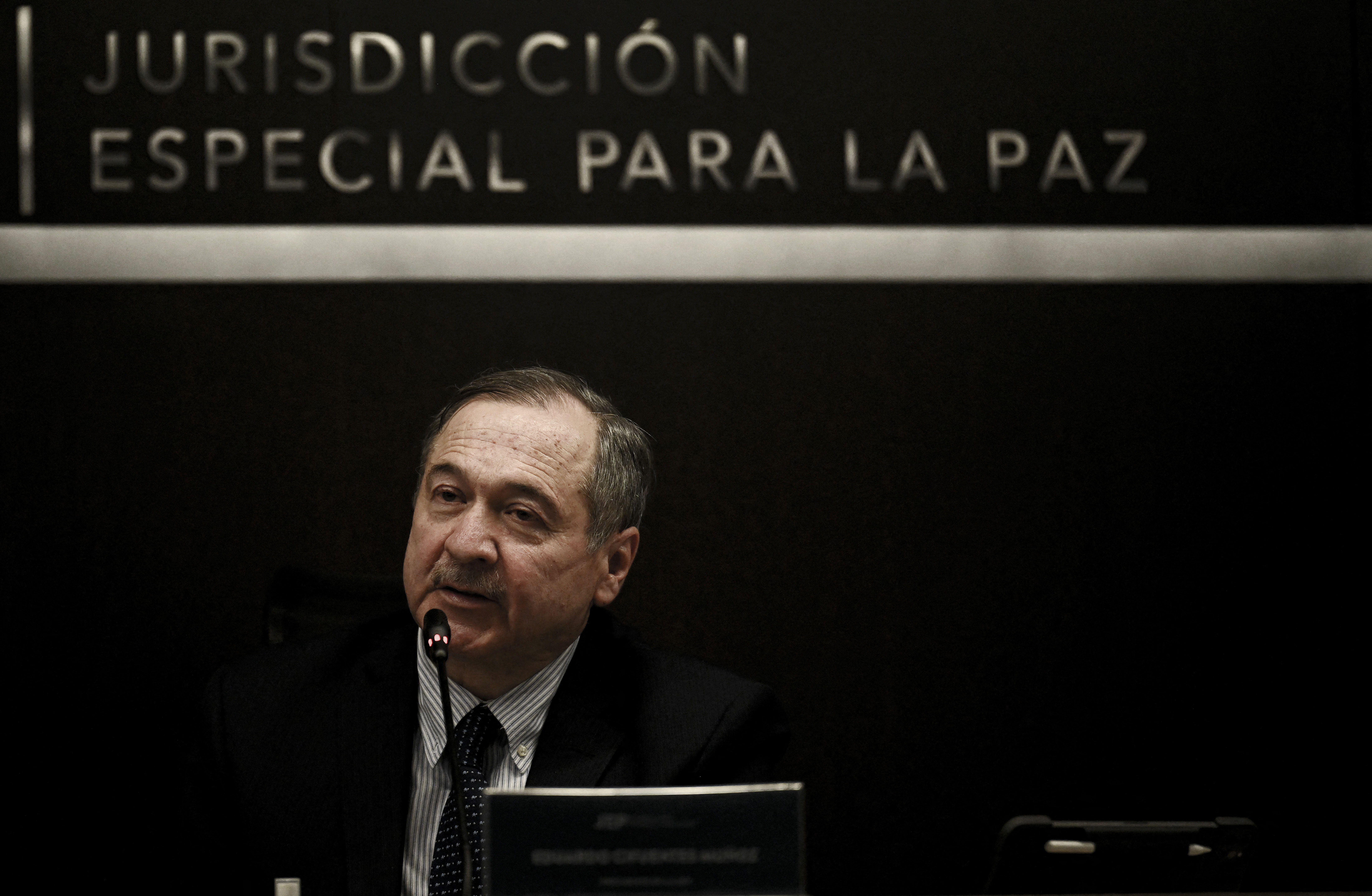 The president of the Special Jurisdiction of Peace (JEP), Eduardo Cifuentes Munoz, says the FARC&#39;s recruitment of children is &#39;one of the most terrible acts&#39; of the country&#39;s decades-long conflict [Juan Barreto/AFP]