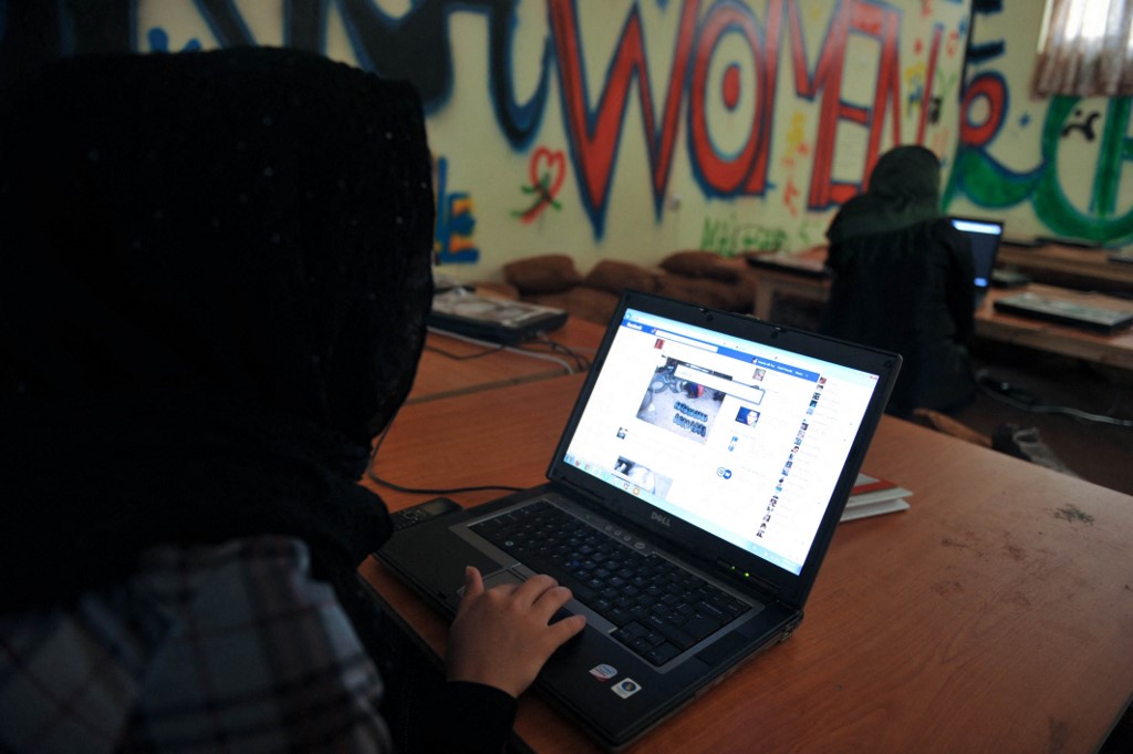 An Afghan woman browses Facebook at the Young Women For Change internet cafe, Afghanistan&#39;s first women-only net cafe, in Kabul [File: Shah Marai/AFP]