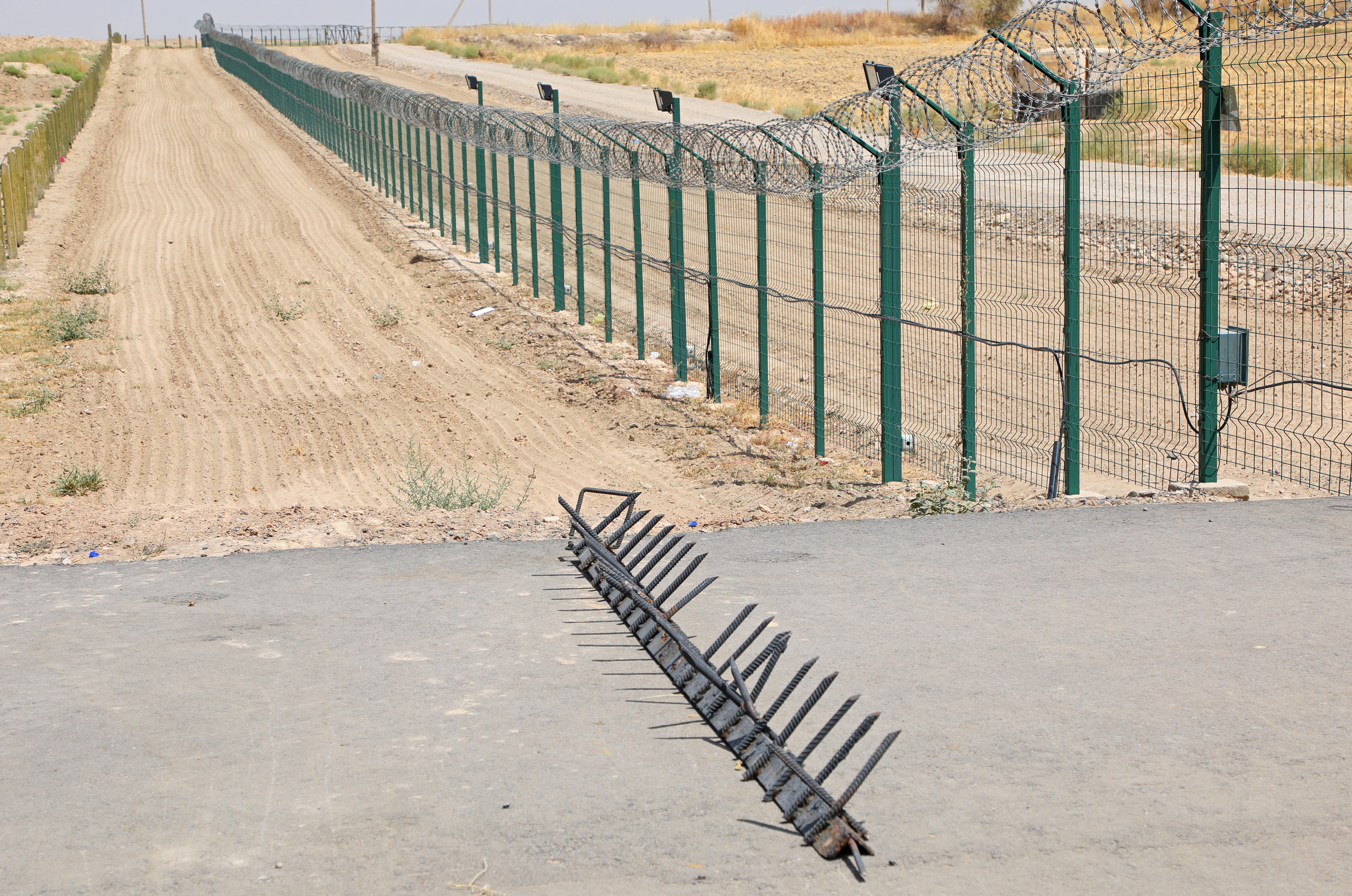 A fence at the Uzbekistan-Afghanistan border in Ayritom [File: Abror Kurbonmuratov/Reuters]