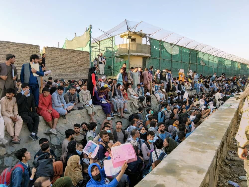 Crowds of people hoping to flee the country wait outside the airport in Kabul, Afghanistan on August 25, 2021 in this picture obtained from social media.[Twitter/David_Martinon via Reuters]