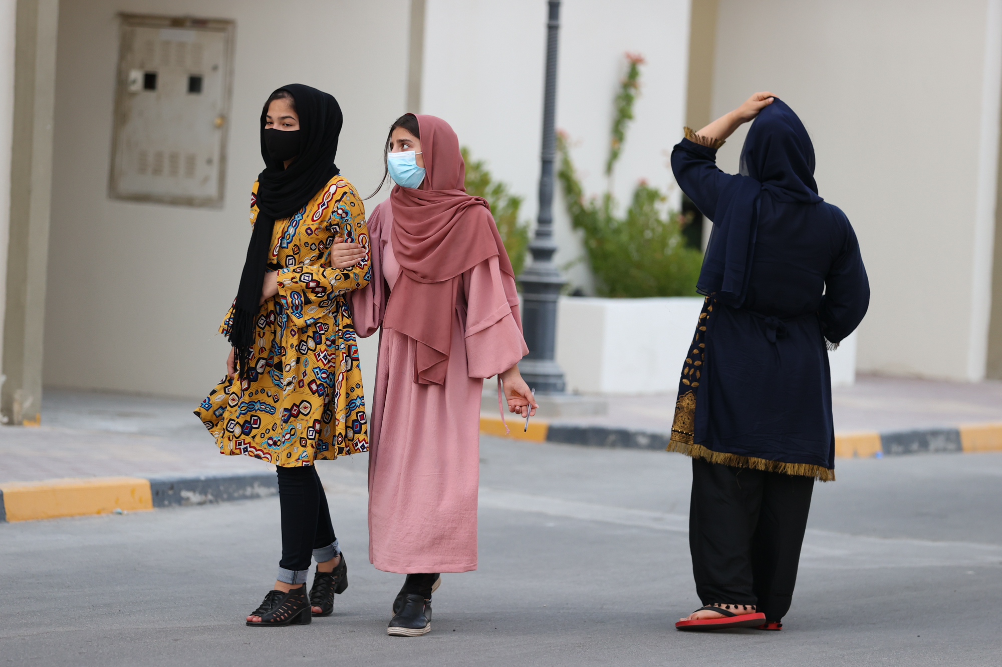 Afghan refugees are seen at a residential compound in Qatar [Showkat Shafi/Al Jazeera]