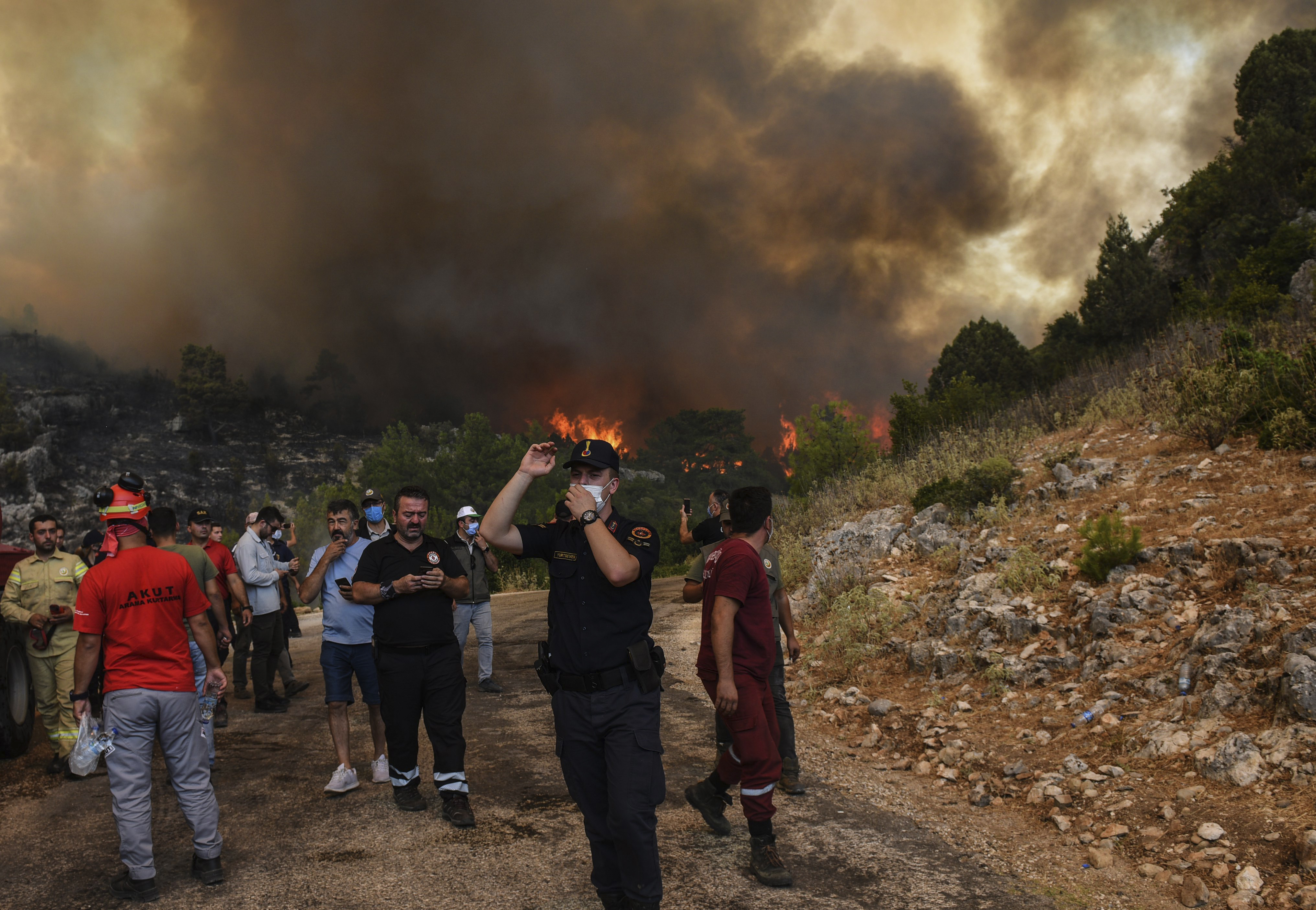 People flee wildfires near Manavgat in southern Turkey in 2021 [AP Photo]