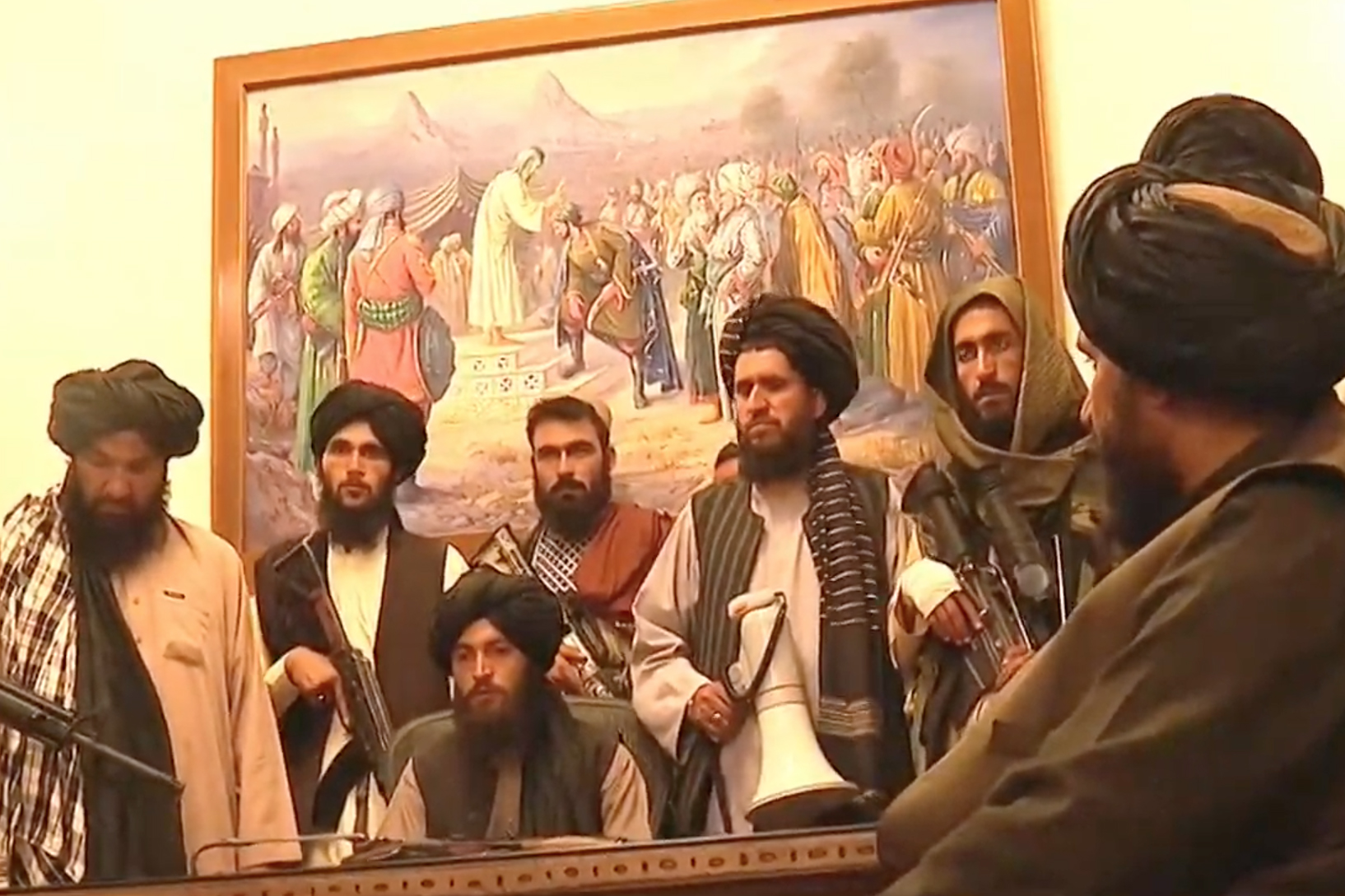Taliban leaders inside the presidential palace [Screen grab/ Al Jazeera]