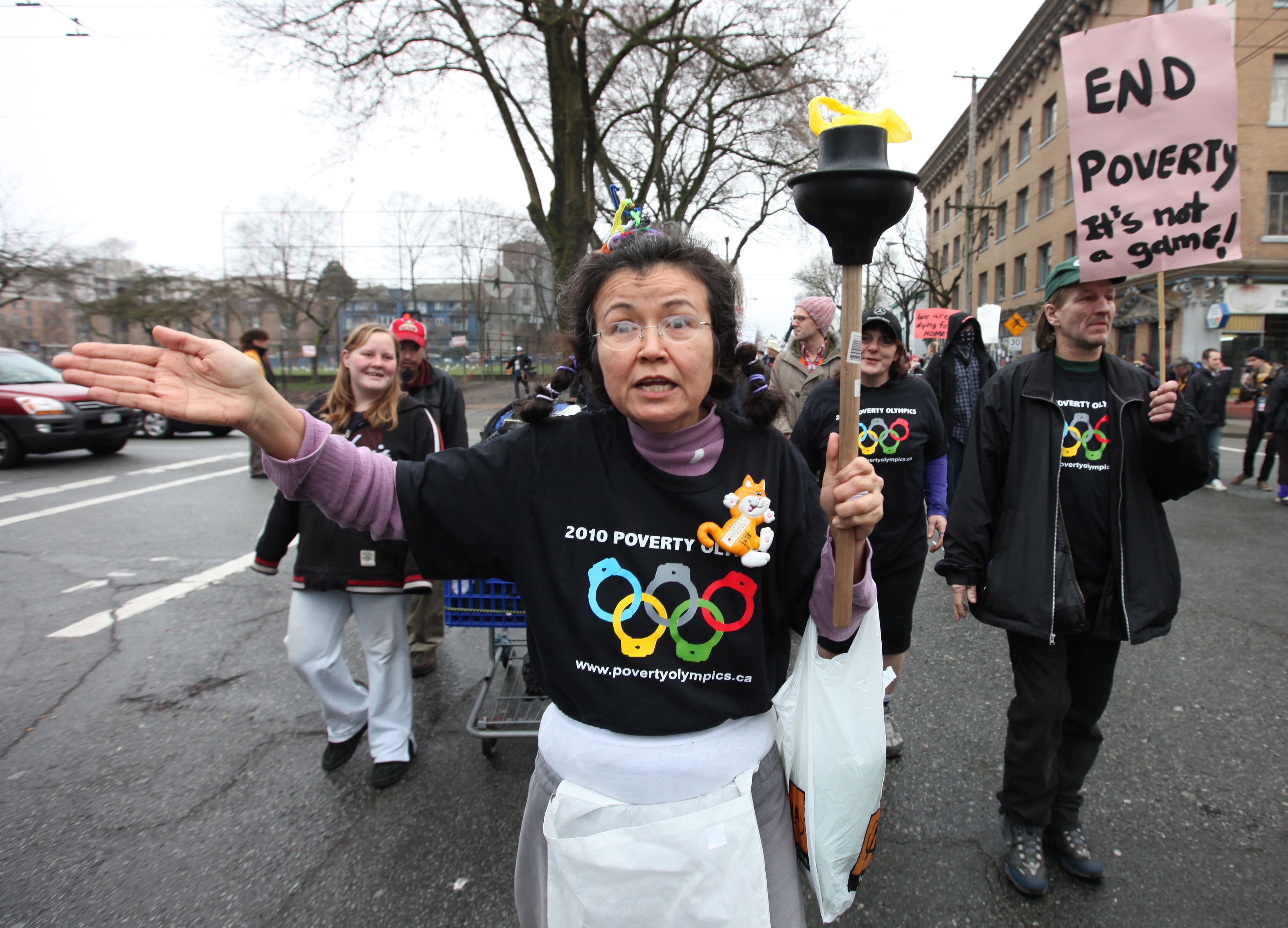 Protesters in Canada started the &#39;Poverty Olympics Torch Relay&#39; using a toilet plunger in place of an Olympic torch [File: Barbara Walton/EPA]
