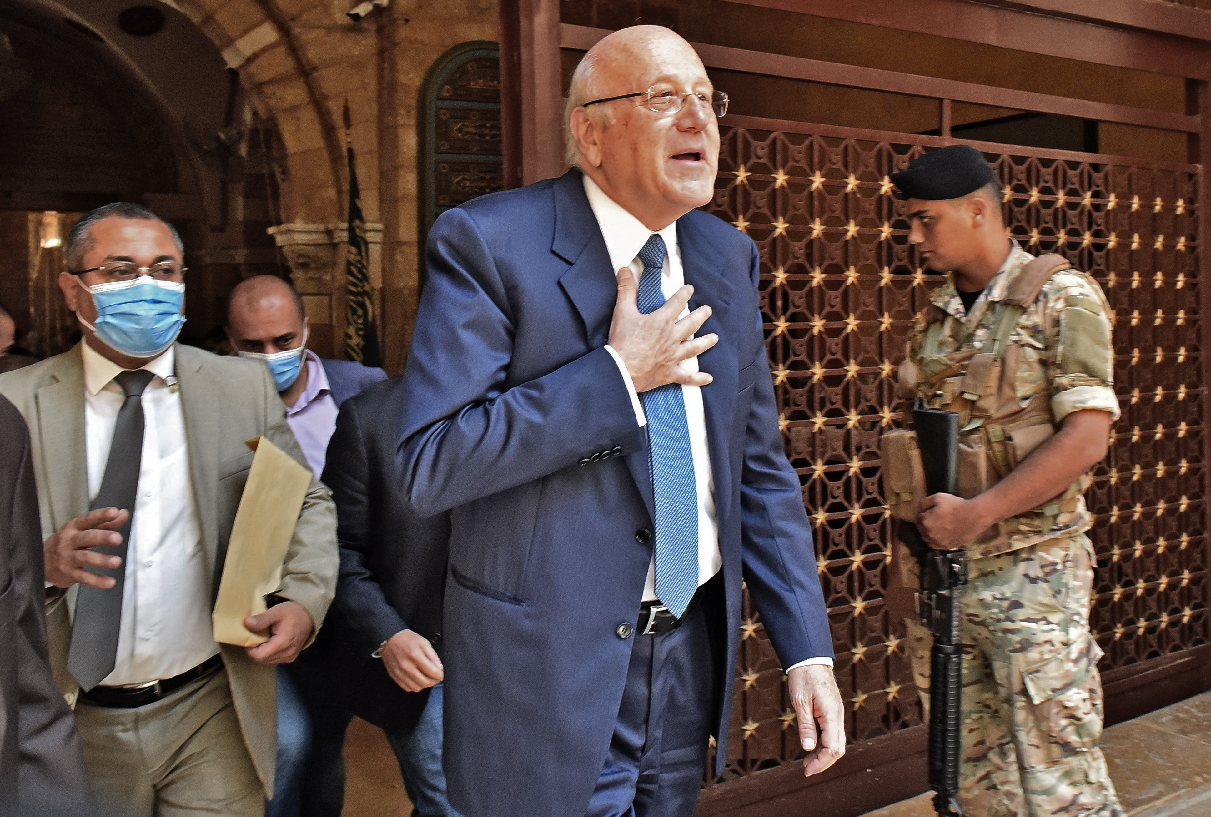 Mikati: &#39;The situation is very difficult. But it’s not impossible if we united as Lebanese. We have to put our hands together.&#39; [AFP]