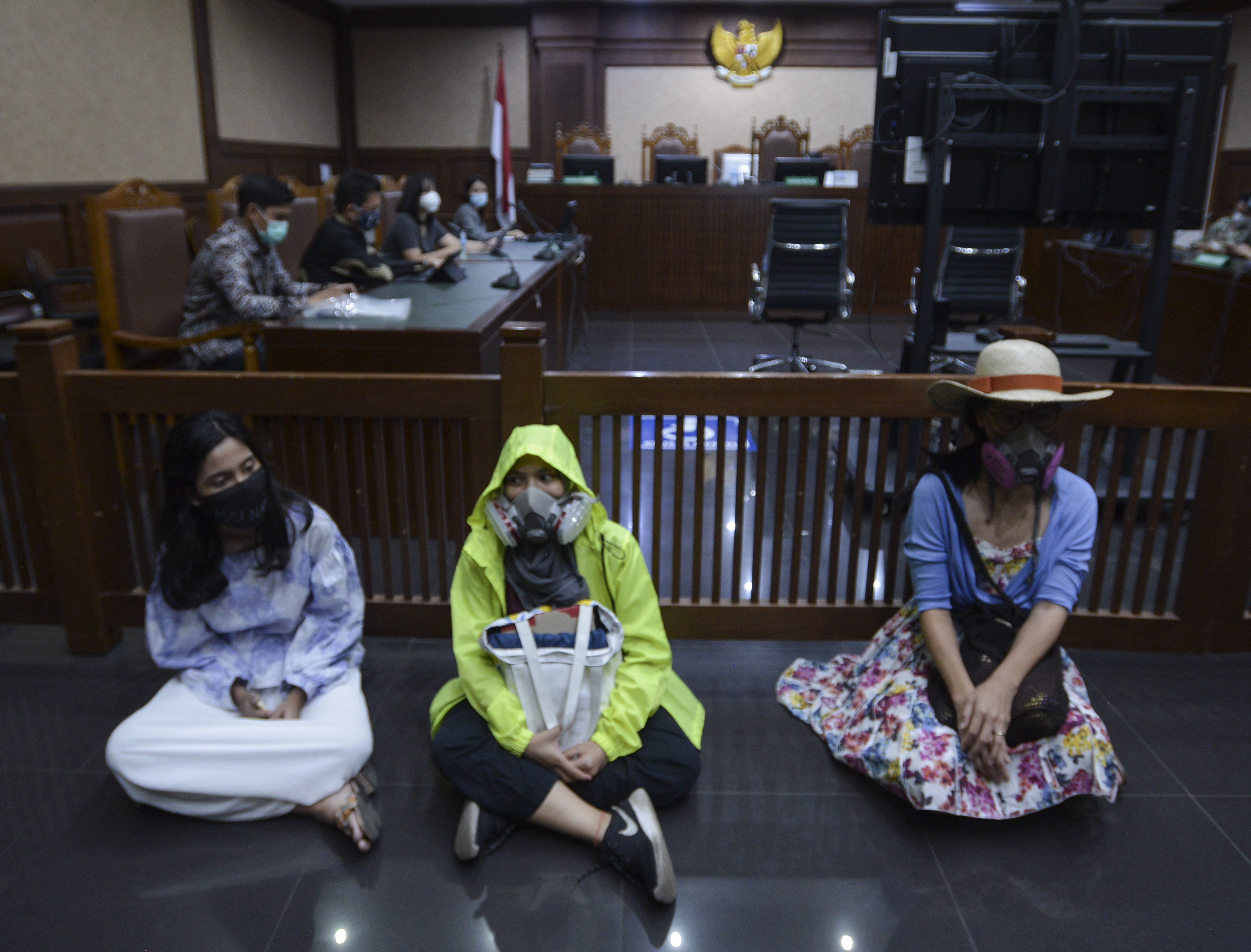 Protesters from the Jakarta Clean Air Initiative Coalition stage a sit-in at the Jakarta District Court ahead of the verdict on Thursday [Jakarta Clean Air Initiative Coalition via Al Jazeera]