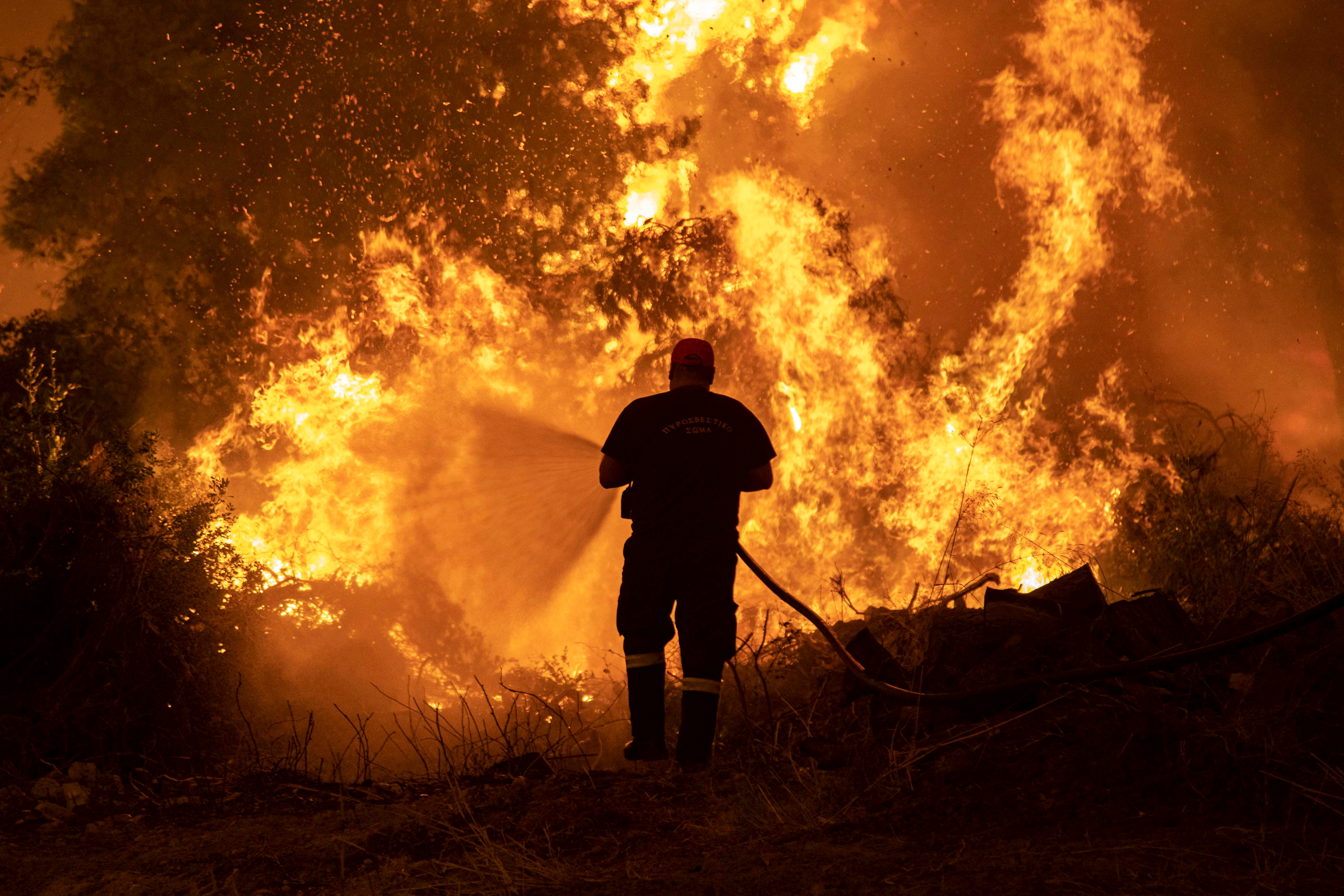 Heatwaves, drought conditions, and reduced soil moisture amplified by global warming have contributed to recent unprecedented fires [File: Nikolas Economou/Reuters]