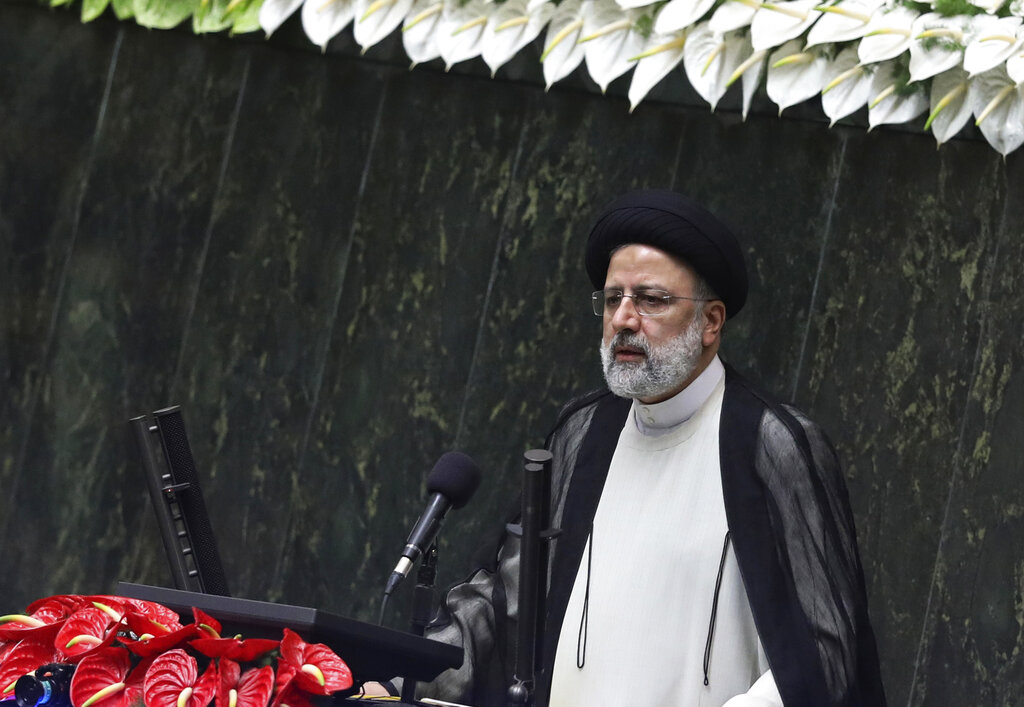 President Ebrahim Raisi delivers a speech at the parliament in Tehran