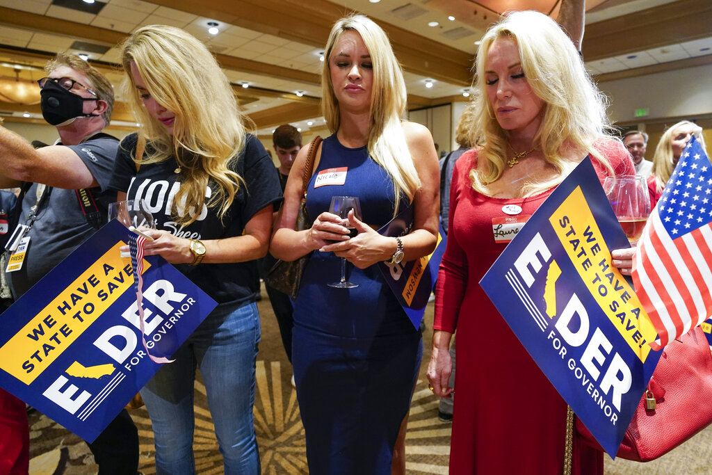 Supporters of conservative California radio host Larry Elder prayed as polls closed on a Republican attempt to recall Democratic Governor Gavin Newsom on September 14 [Ashley Landis/AP Photo]