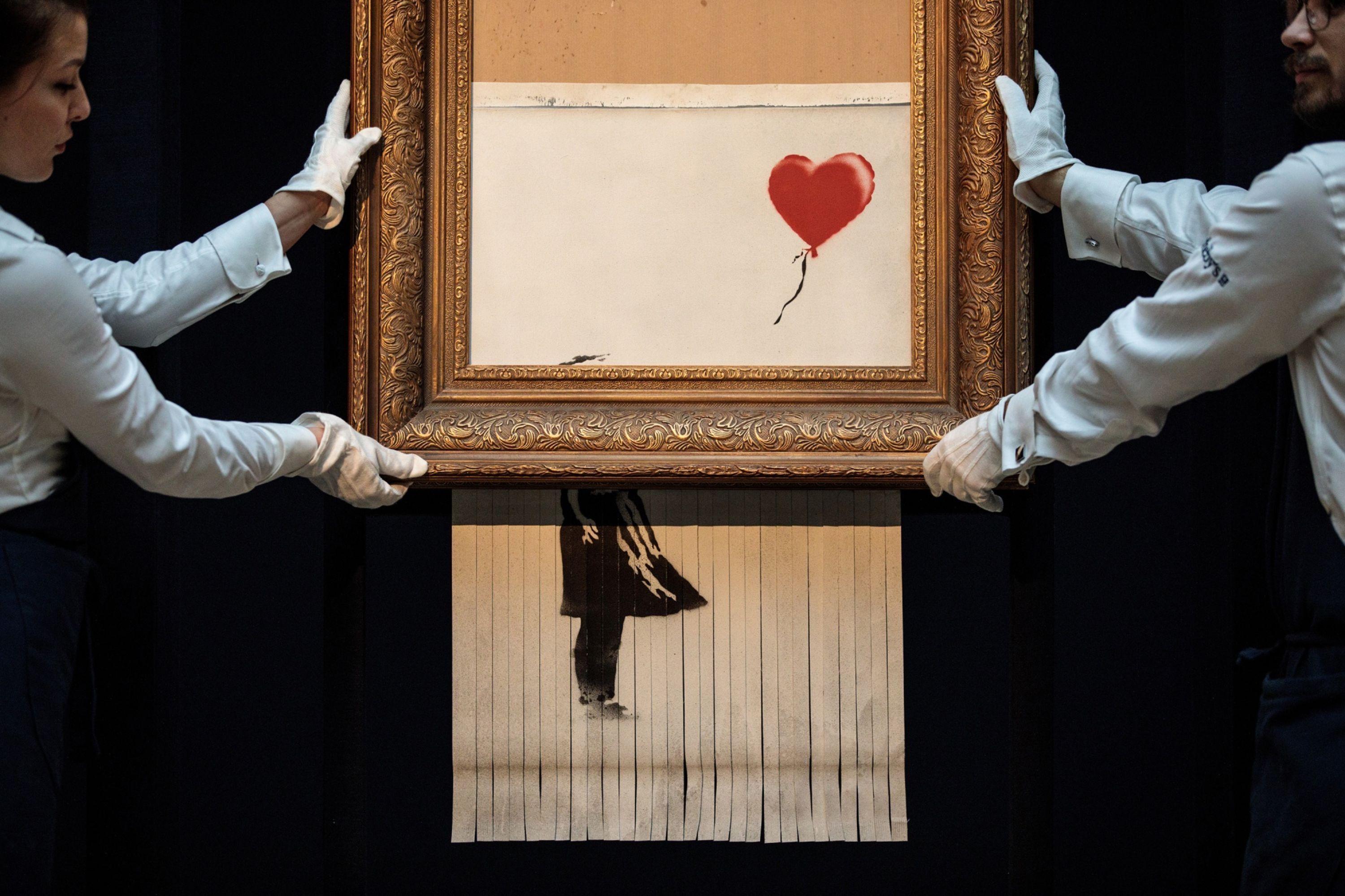 While other works by Banksy have sold for more, the painting, which was initially titled &#39;Girl with Balloon&#39; and which the artist renamed &#39;Love is in the Bin&#39; after it was shredded, carries the highest presale estimate ever placed on his pieces [File: Bloomberg]