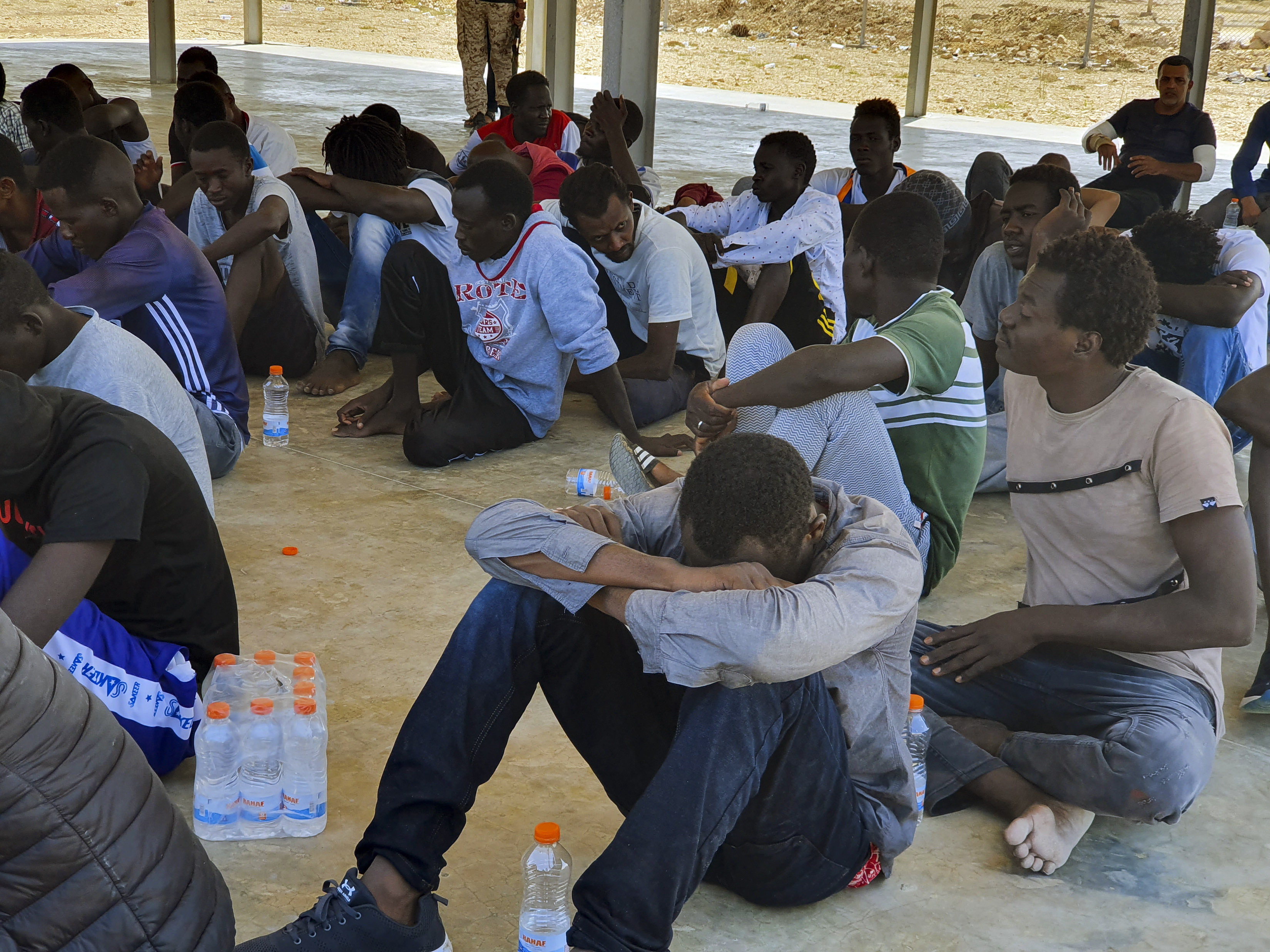 Rescued migrants rest near the city of Khoms, around 120 kilometres (75 miles) east of Tripoli, Libya [File: Hazem Ahmed/AP]