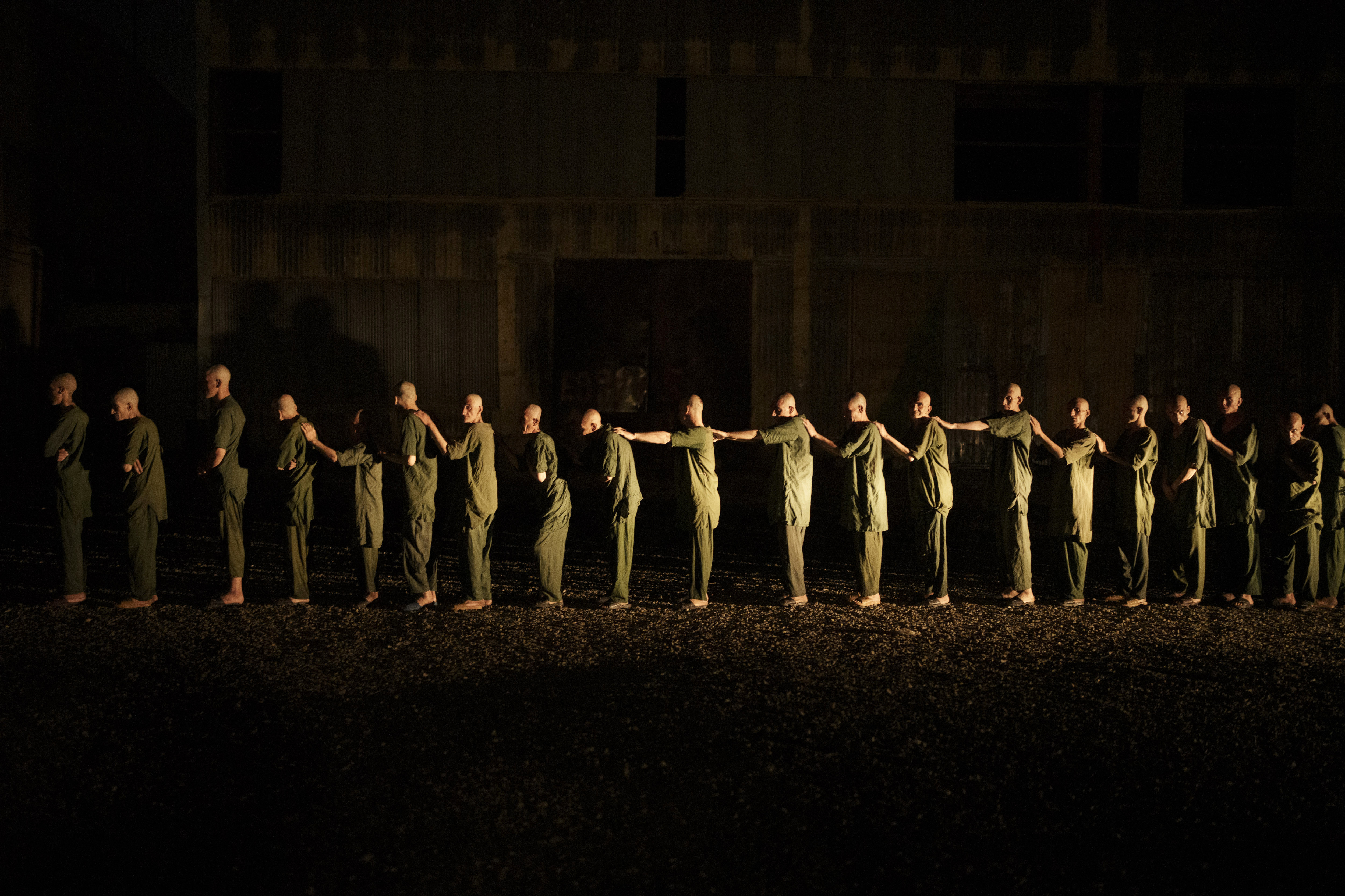 Drug users detained during a Taliban raid walk in line on their way to the detoxification ward of the Avicenna Medical Hospital for Drug Treatment in Kabul. [Felipe Dana/AP Photo]