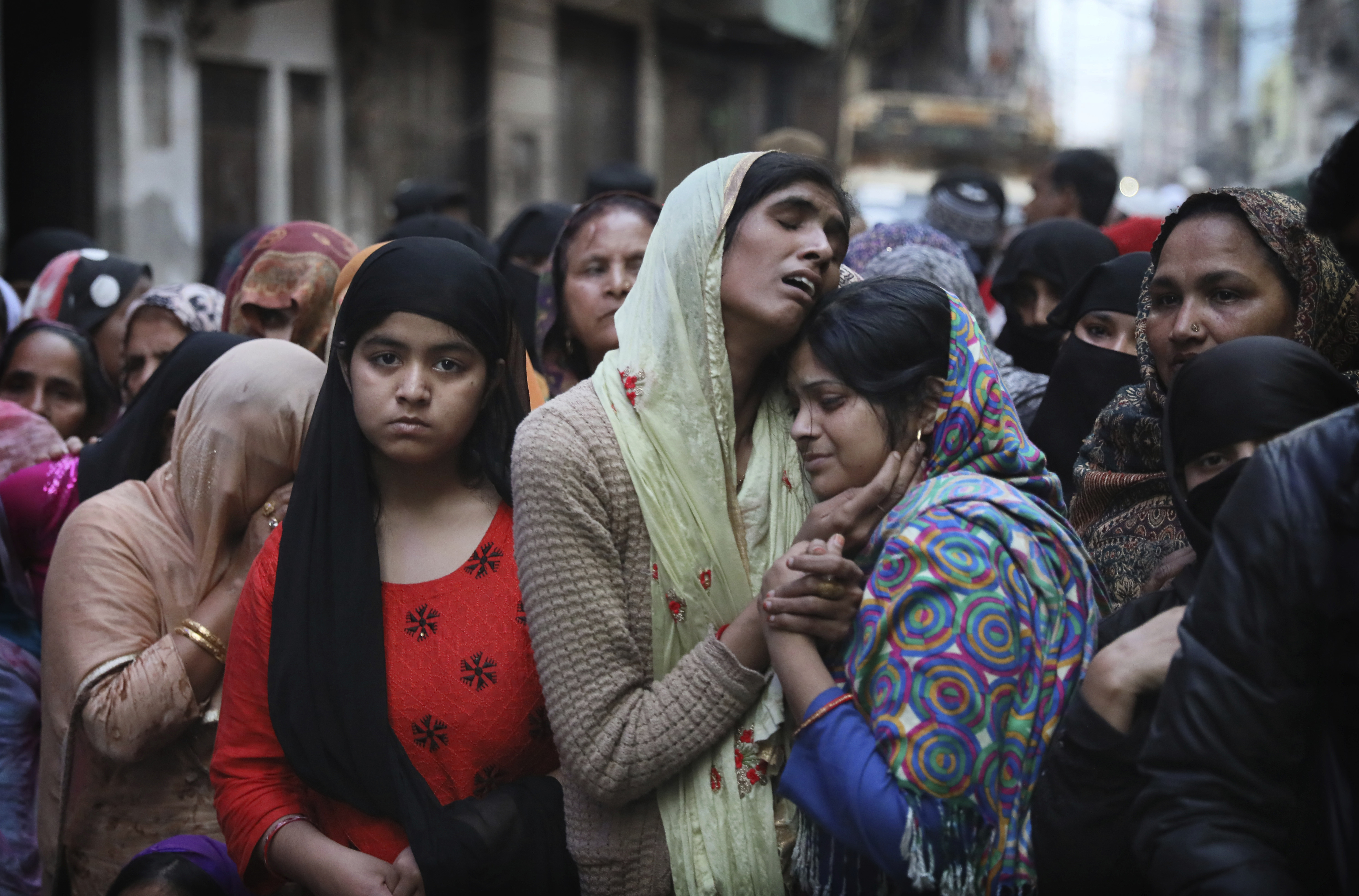 In this February 27, 2020 photo, relatives wail near the body of Mohammad Mudasir, 31, who was killed in religious violence in New Delhi [File: Manish Swarup/AP]