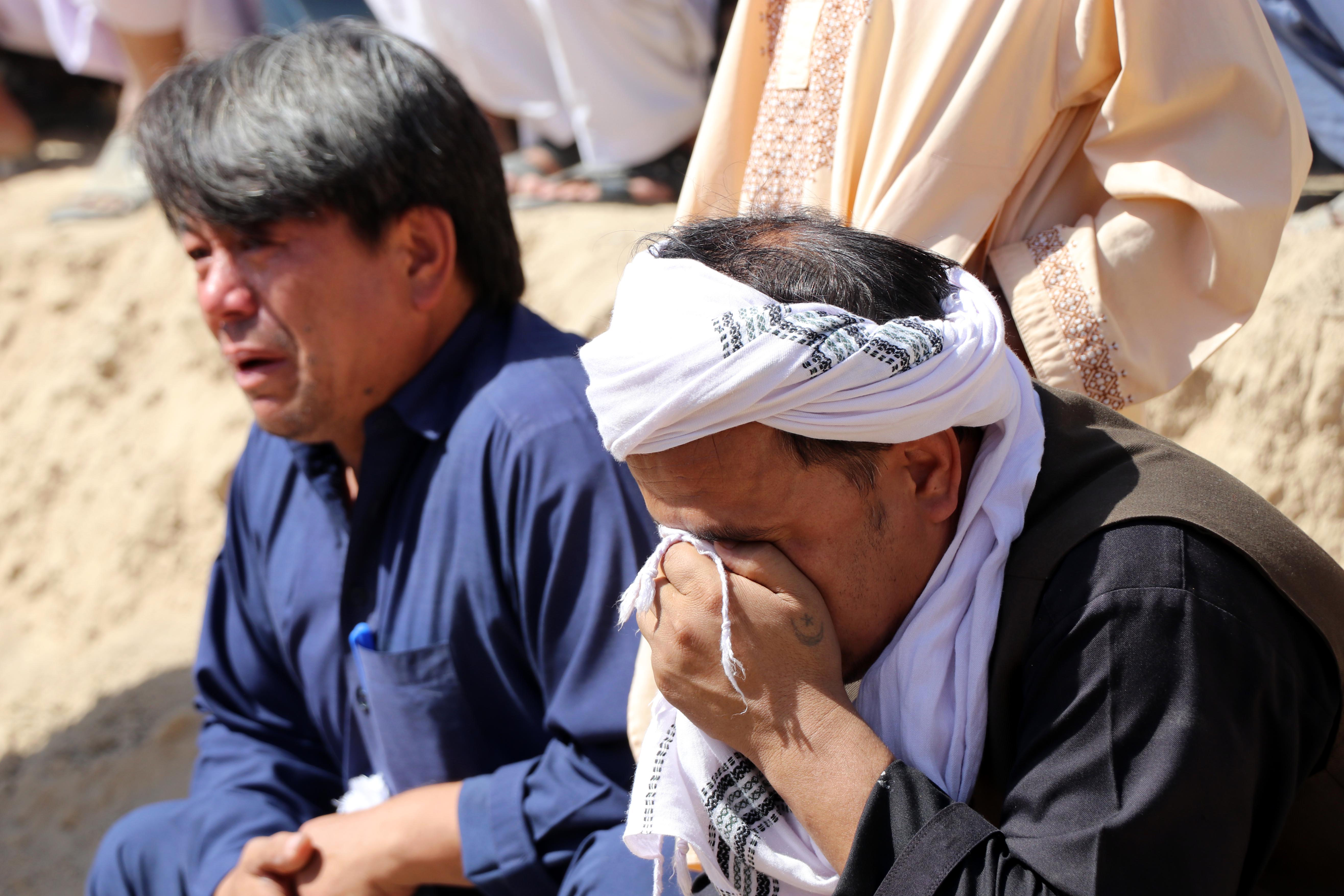 Relatives attend the funeral of the victims of a bomb blast during Friday prayers at a Shia mosque in Kandahar, Afghanistan on October 16, 2021 [EPA]