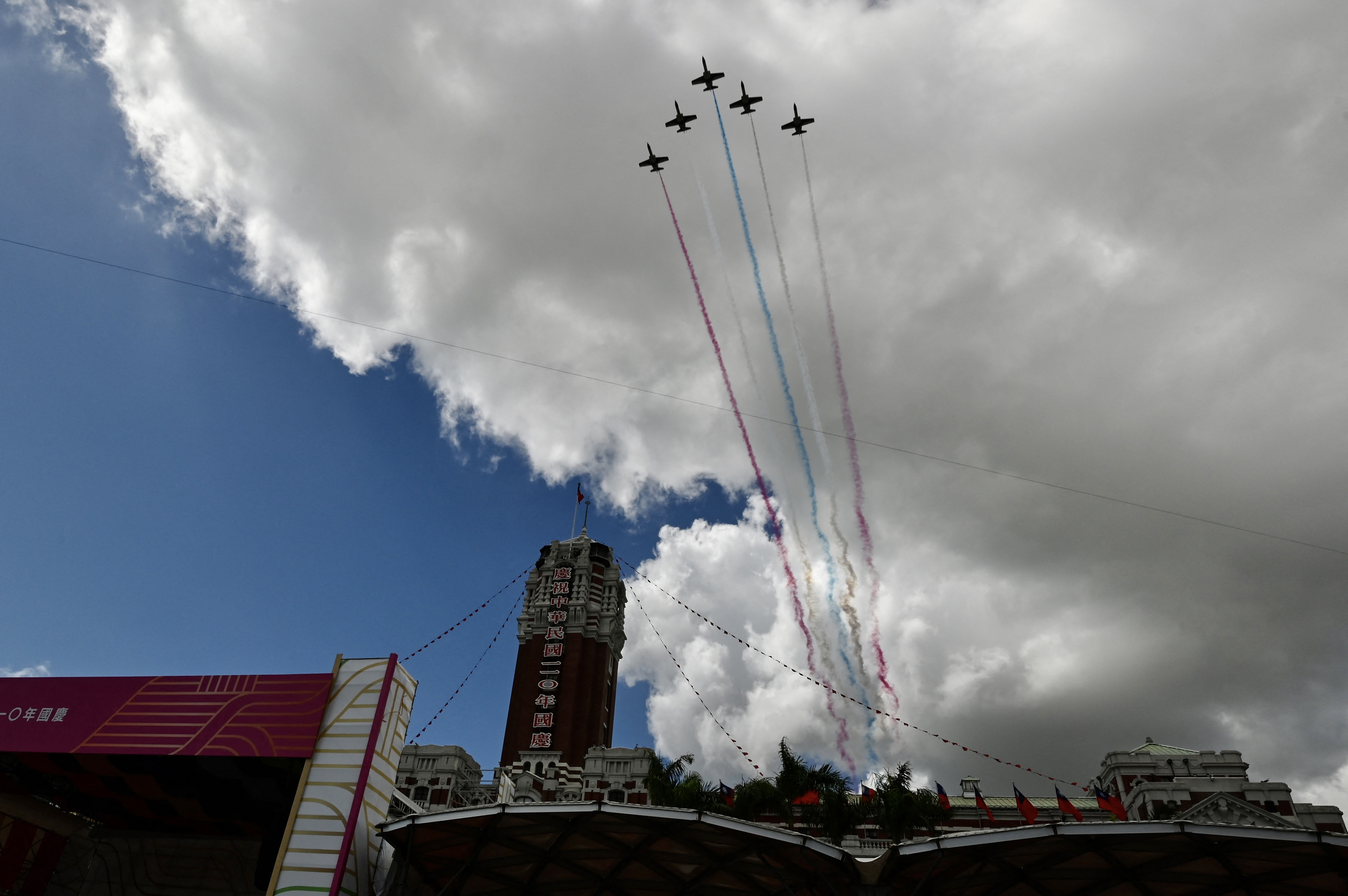 Taiwanese Air Force AT-3 jets fly over the Presidential Palace during national day celebrations in Taipei. [File: Sam Yeh/AFP]