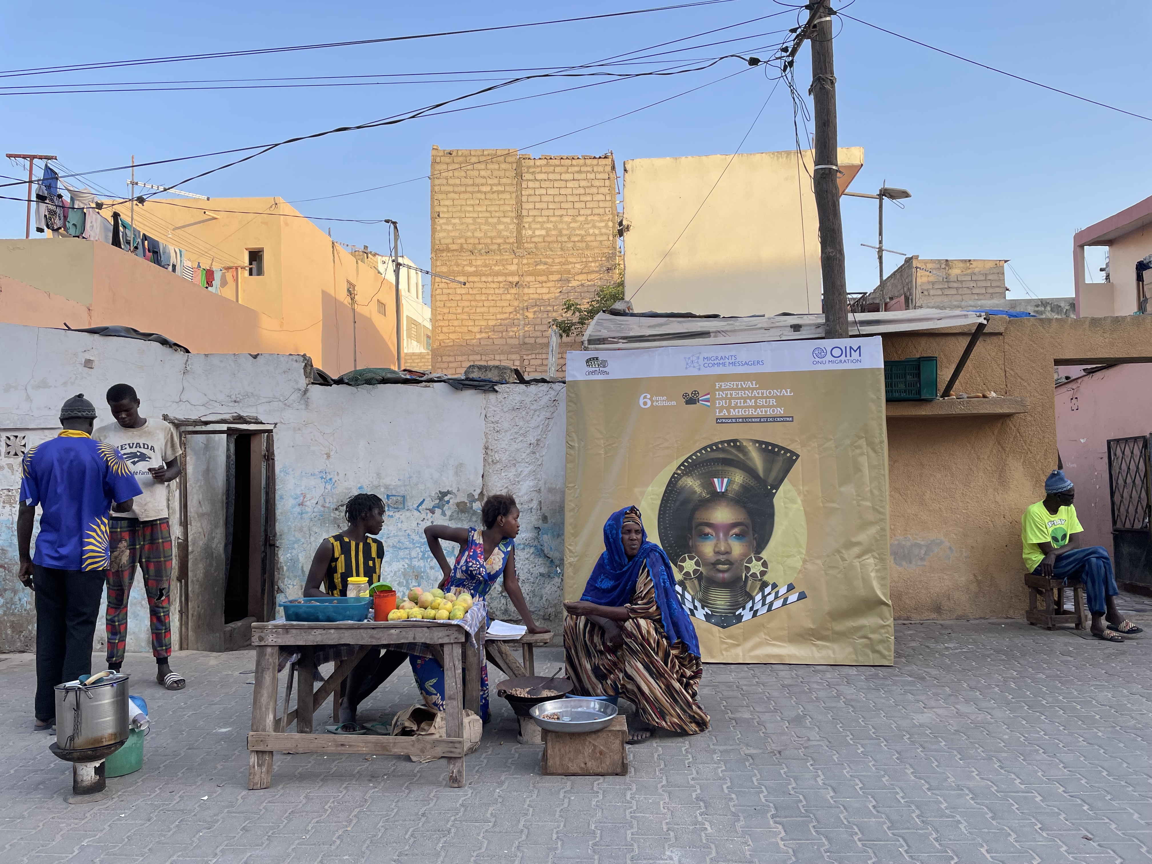 Residents of Dakar&#39;s Yaraax neighbourhood pictured ahead of a community screening of Aïssata Ndiaye&#39;s Sous Mes Pieds on November 20 [Portia Crowe/Al Jazeera]