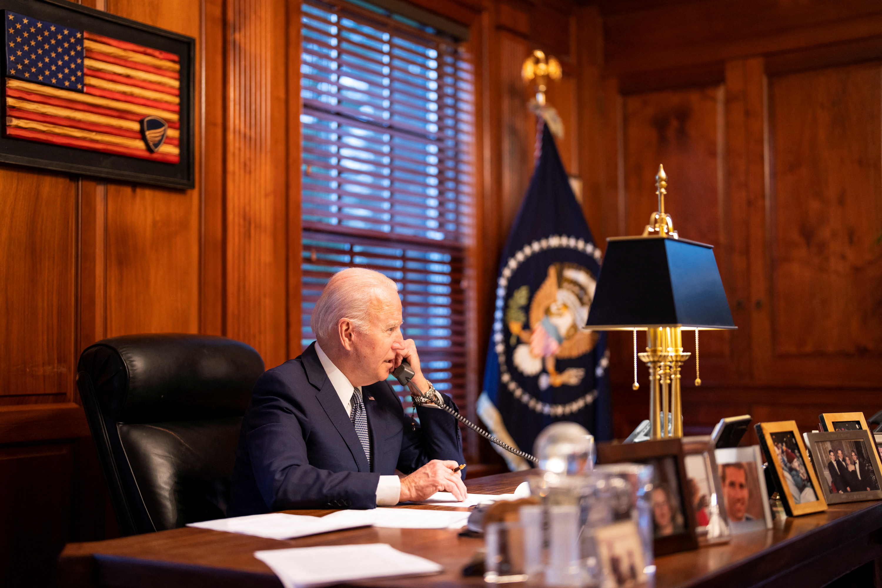 US President Joe Biden spoke with Russia&#39;s President Vladimir Putin from his home in Wilmington, Delaware, on December 30, 2021 [Adam Schultz/White House/Handout via Reuters]