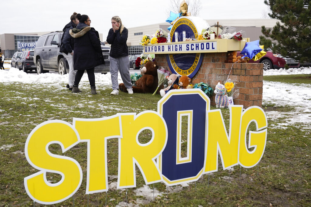 Four students were killed and seven other people were injured after gunman opened fire at Oxford High School, north of Detroit, on November 30 [File: Paul Sancya/AP Photo]