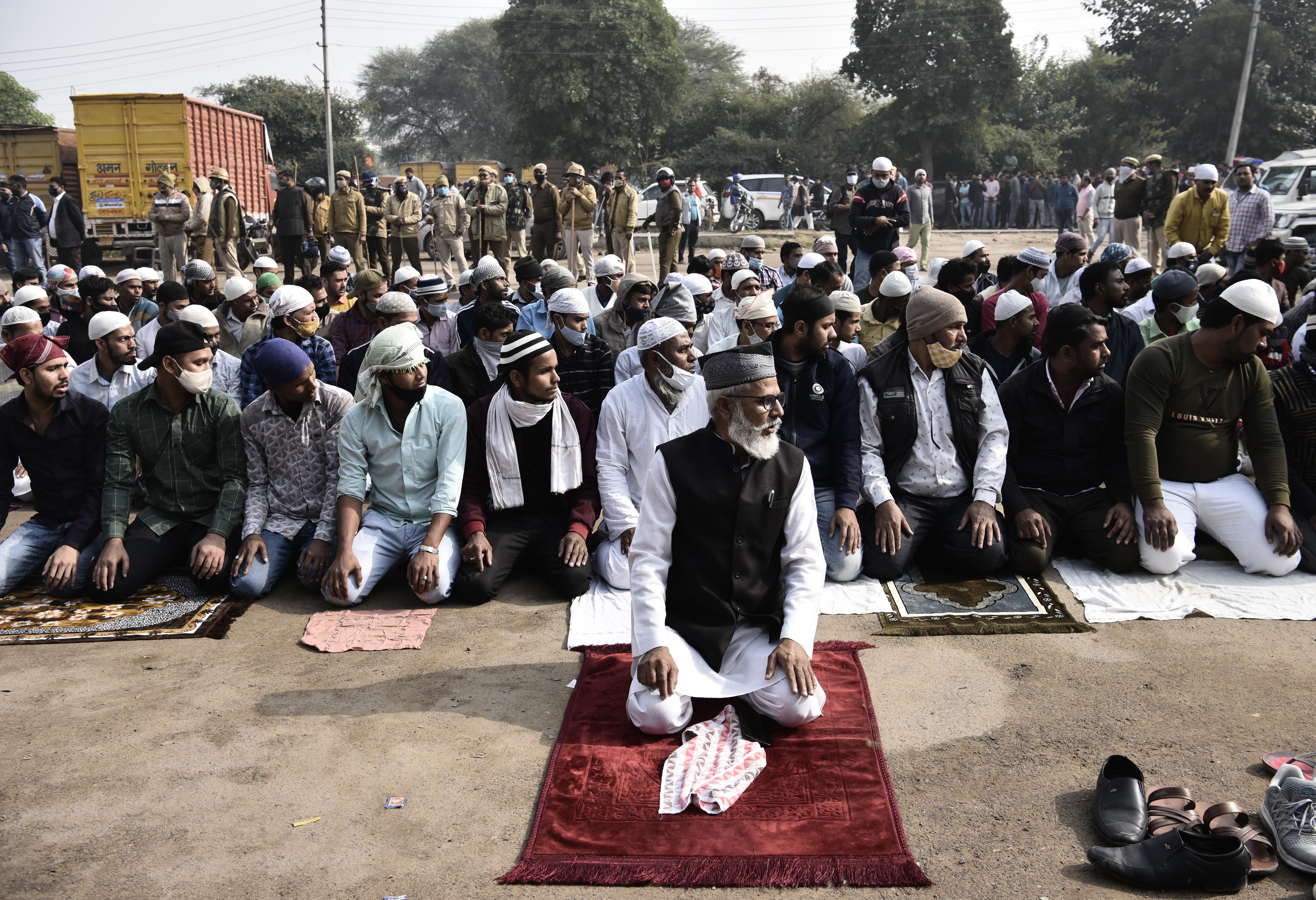 Muslim devotees offer Namaz at Sector 37 parking area amidst protests, on December 3, 2021 in Gurugram, India [Vipin Kumar/Hindustan Times via Getty Images]