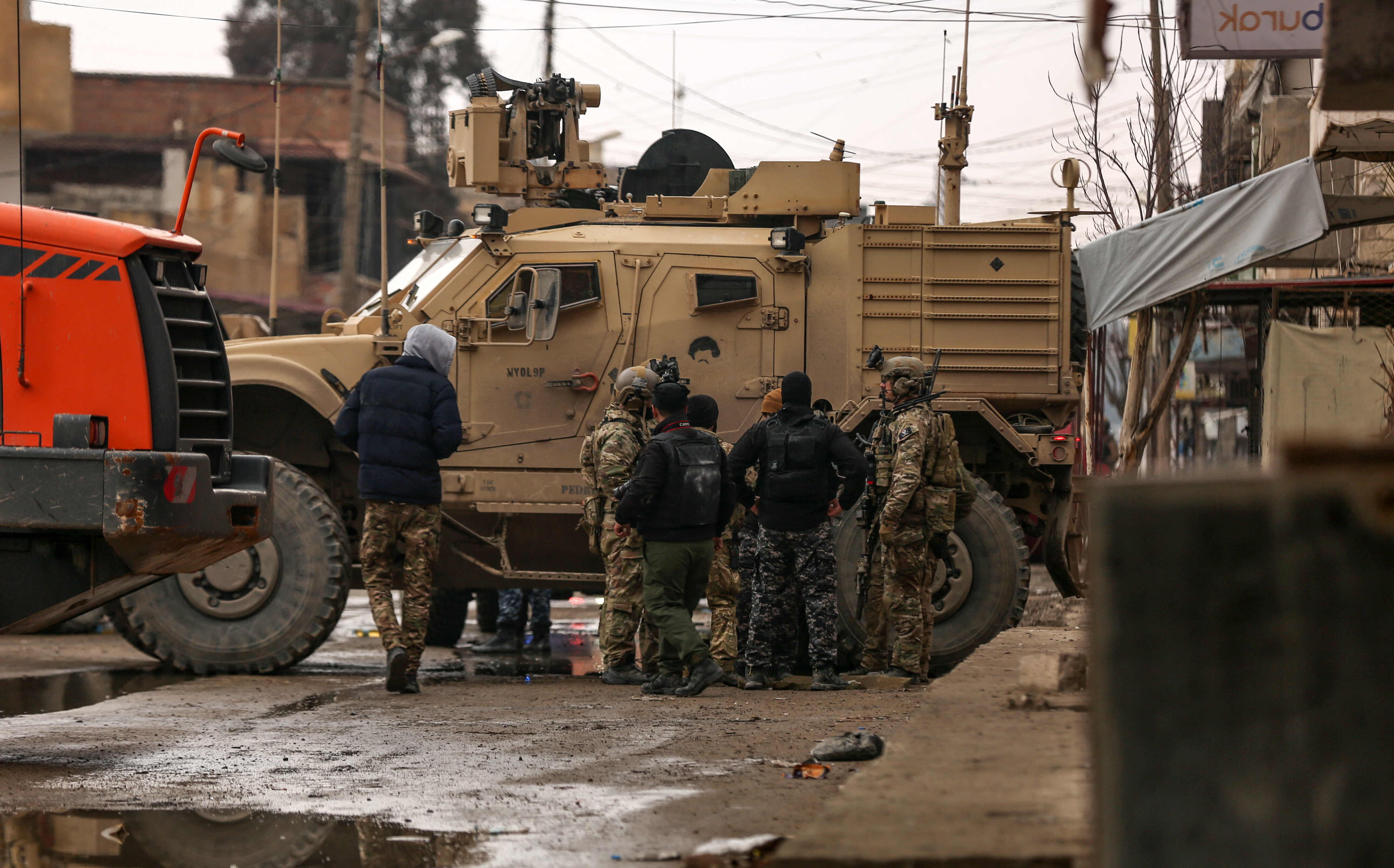 Syrian Democratic Forces (SDF) gather in the neighbourhood of Ghwayran, in the northeastern Syrian city of Hasakeh, to search for affiliates of the the Islamic State (ISIL) group