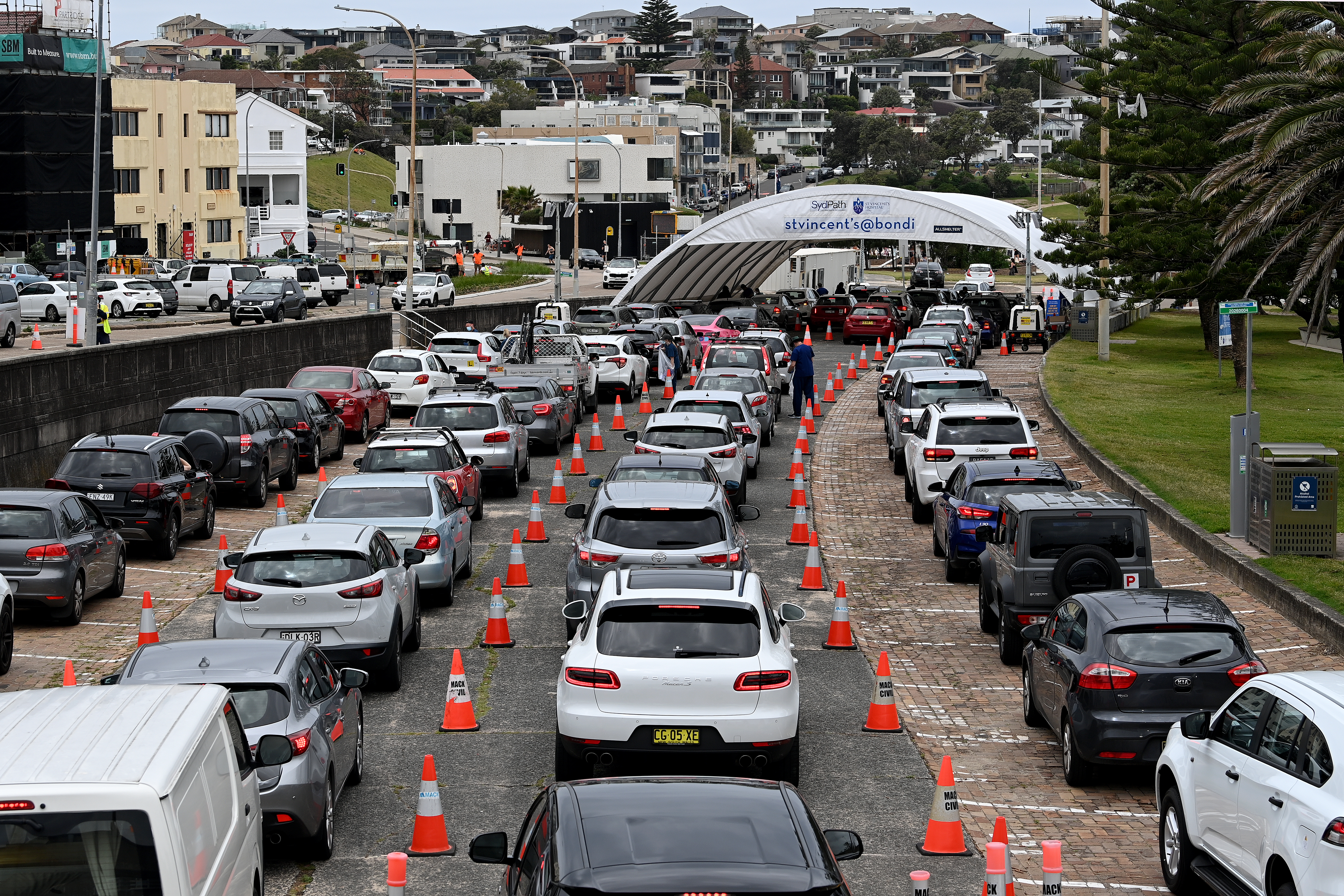 Three long lines of cars at the St Vincent?s Hospital drive-through testing clinic