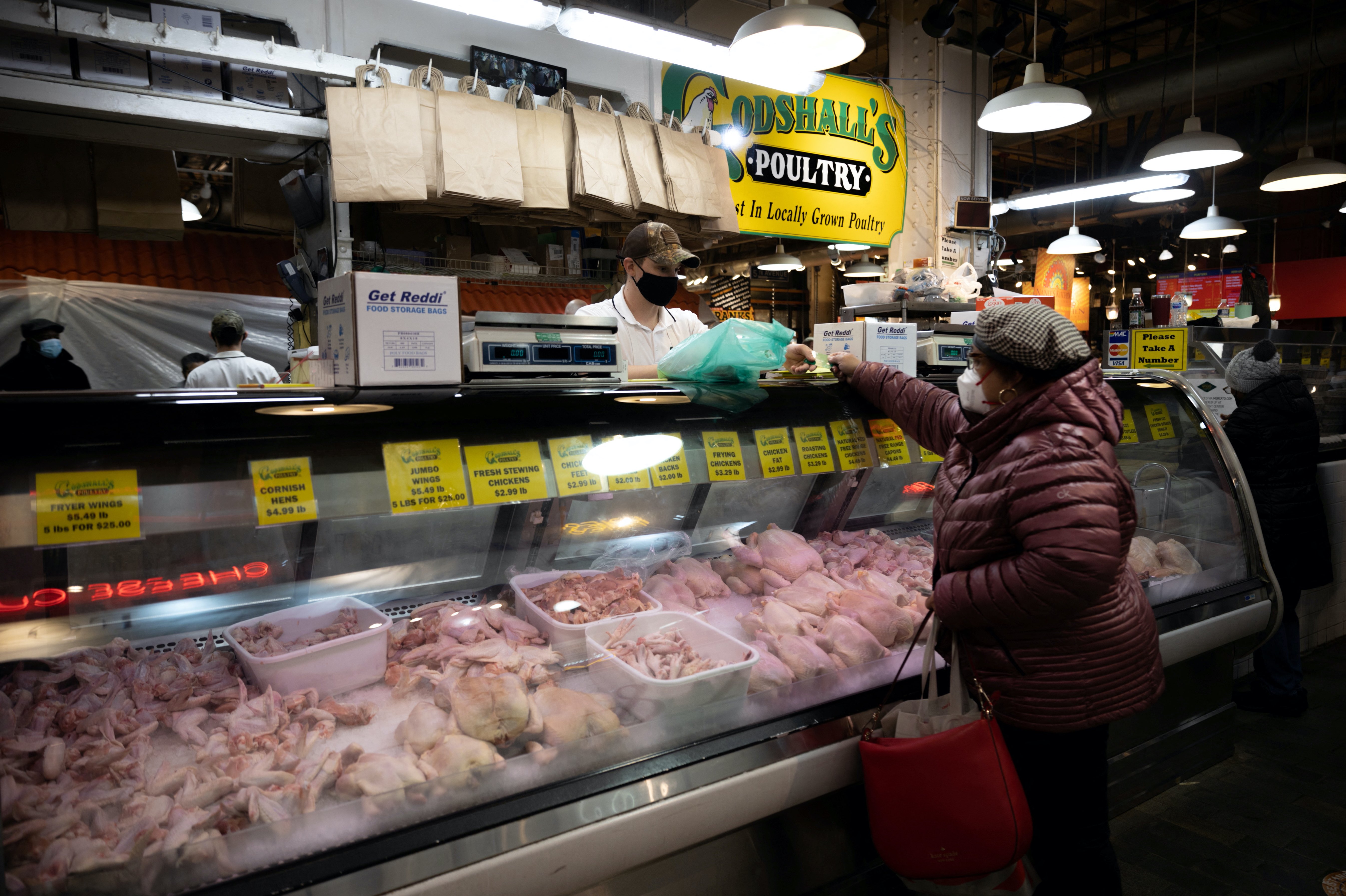 A customer shops at a poultry shop in Philadelphia, Pennsylvania
