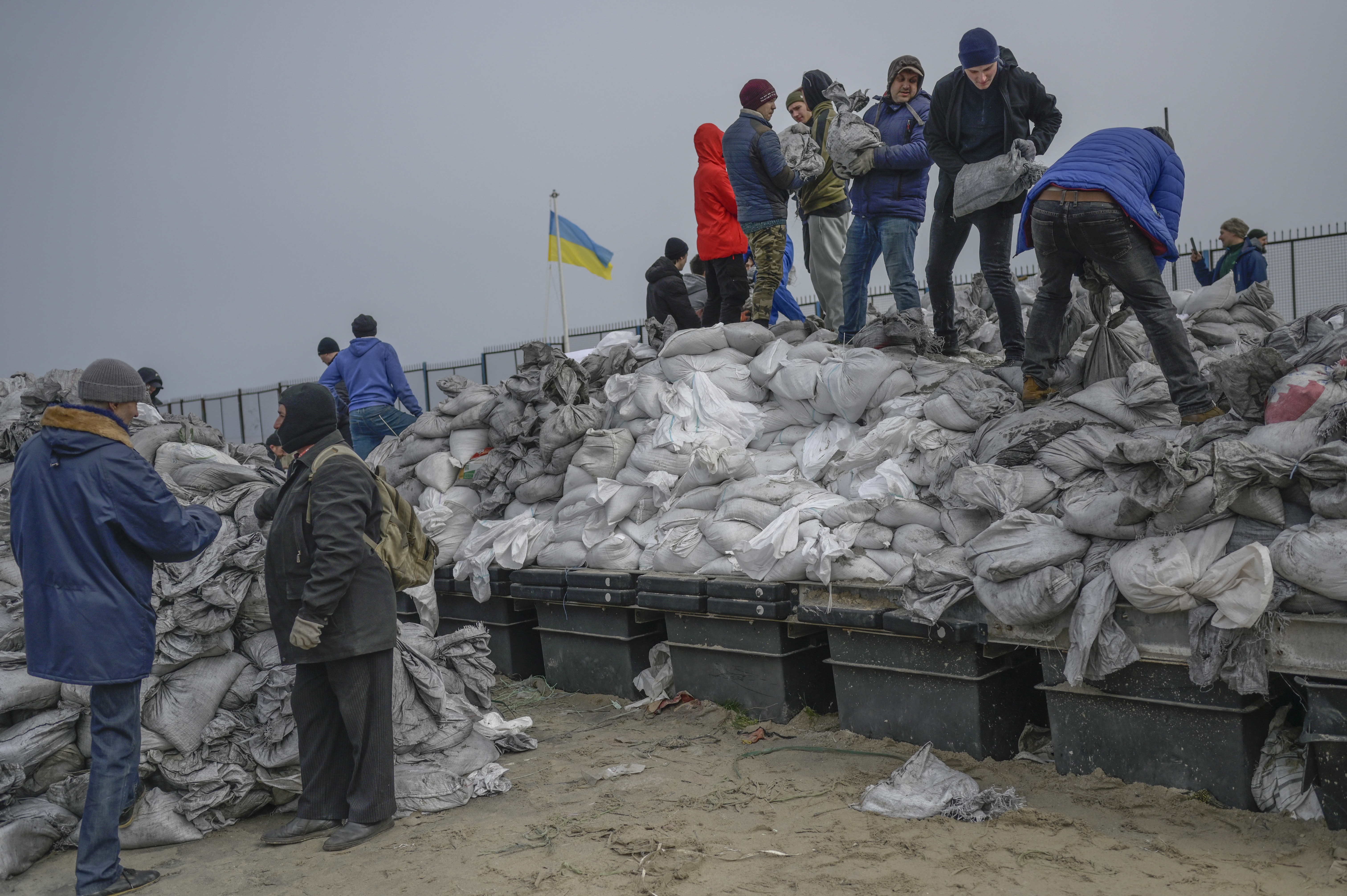 Citizens fill bags with sand for frontlines, along the beach of the Black Sea city of Odessa