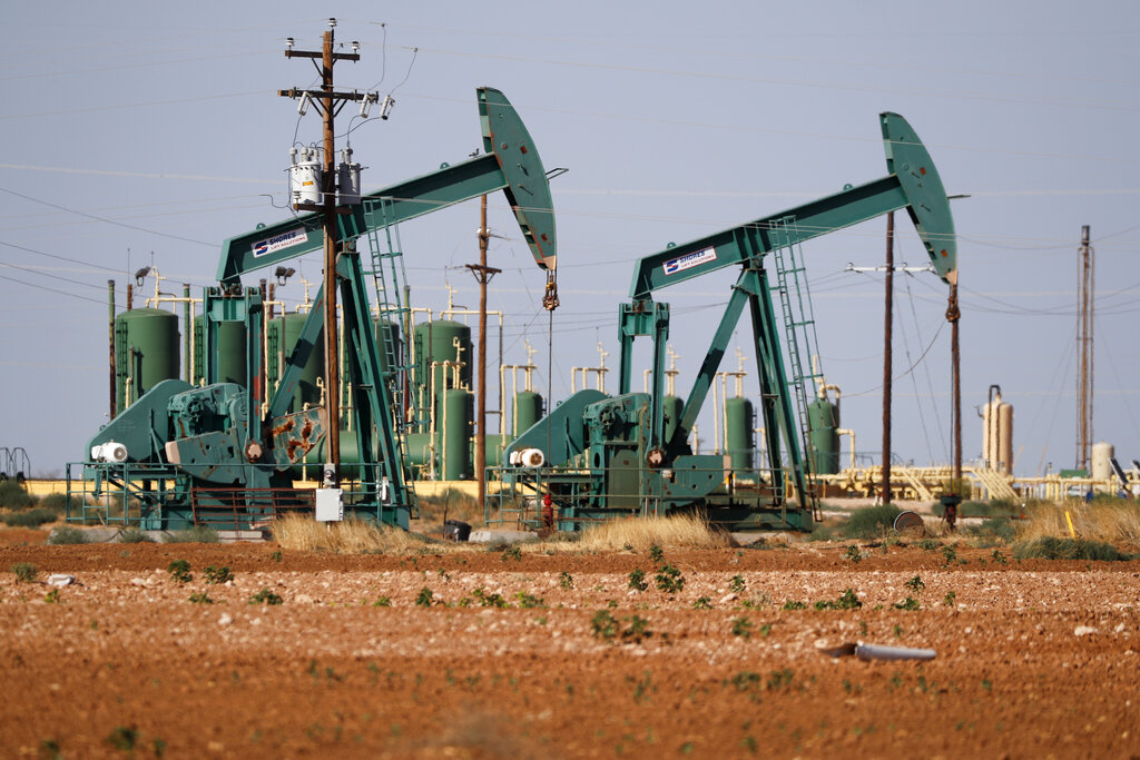 a view of a pump jack operateing in an oil field in Midland, Texas.