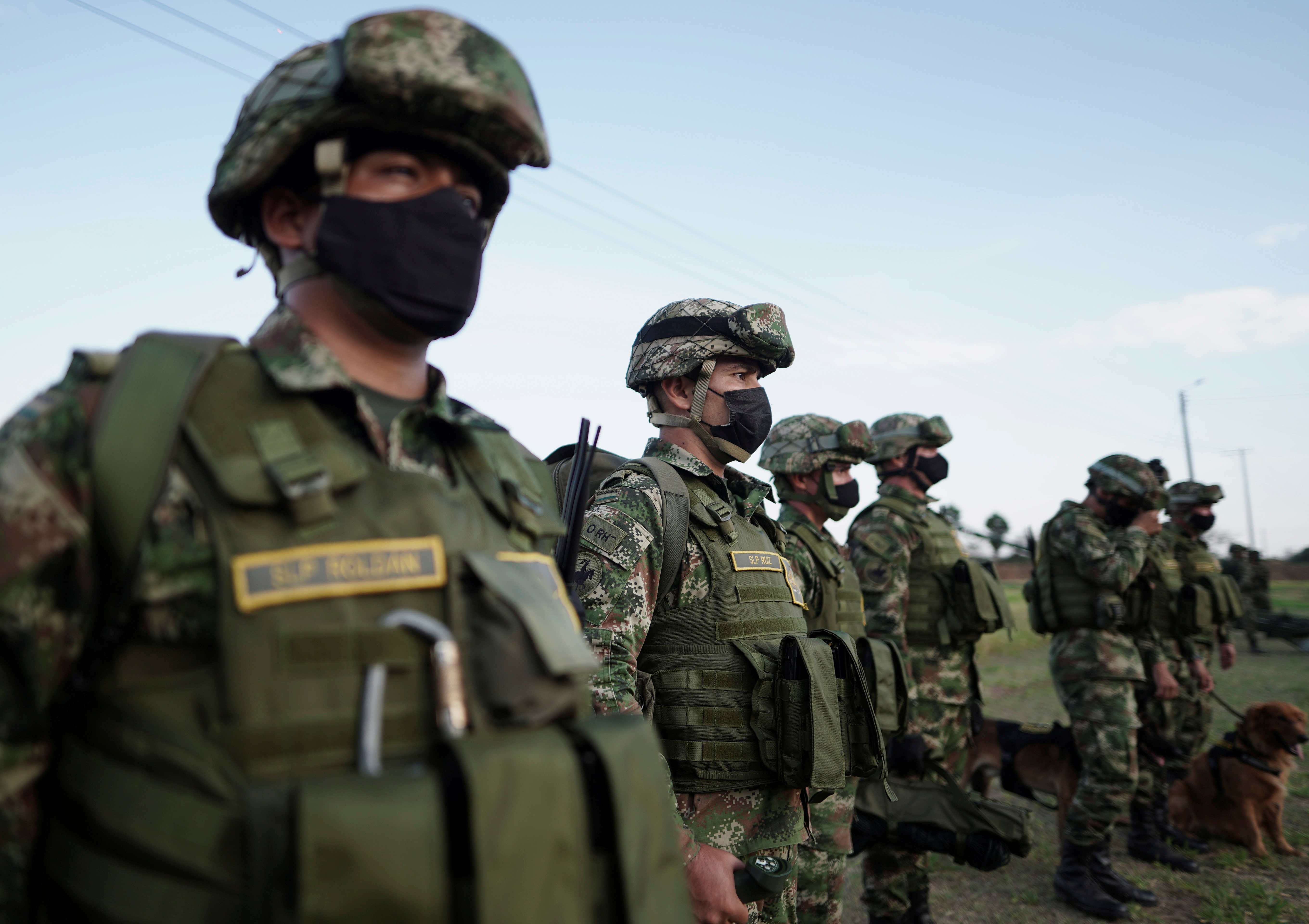 Colombian soldiers stand in a line.