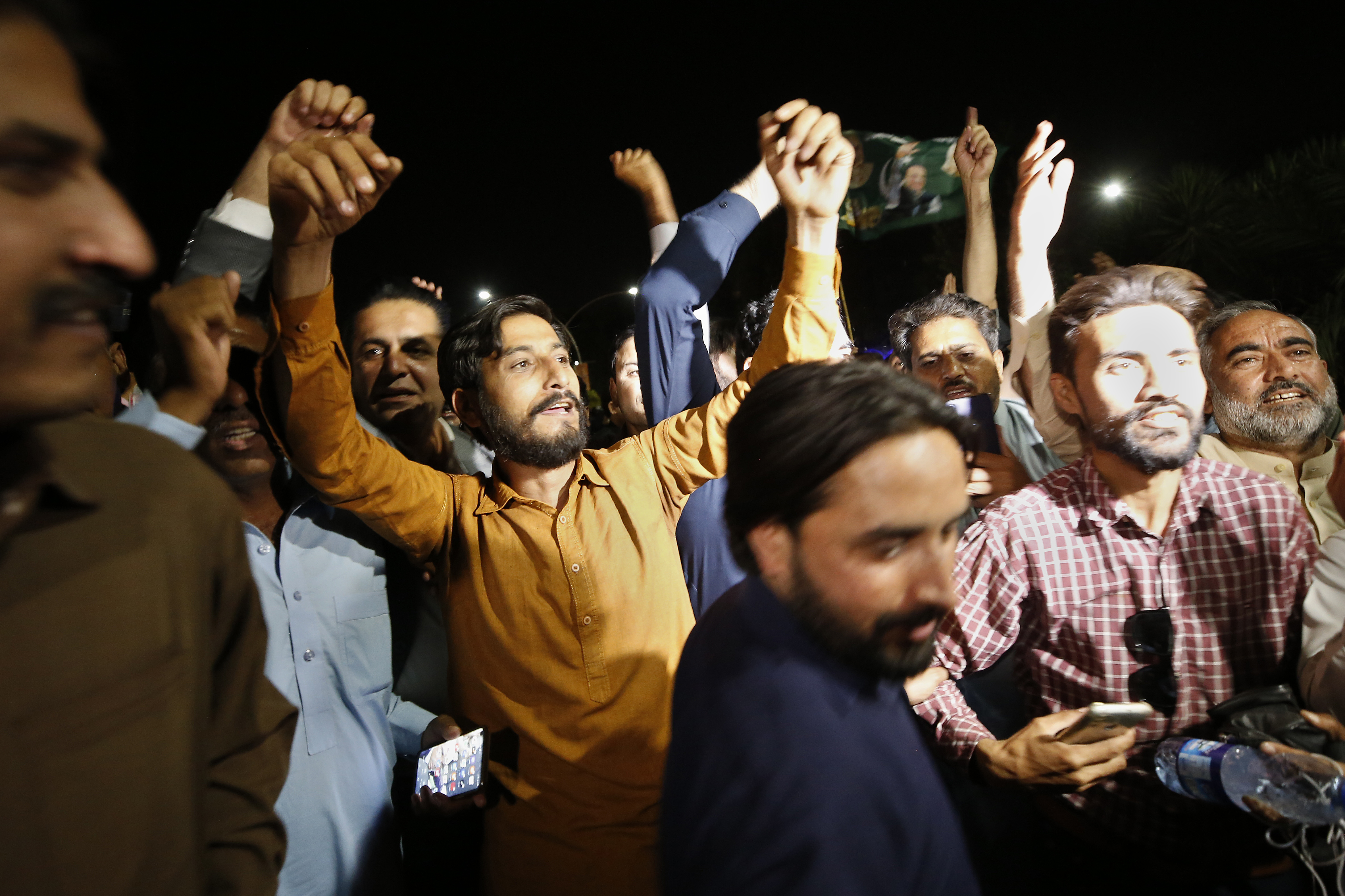 Supporters of Pakistan&#39;s opposition react after the Supreme Court decision in the capital Islamabad on Thursday [Anjum Naveed/AP]