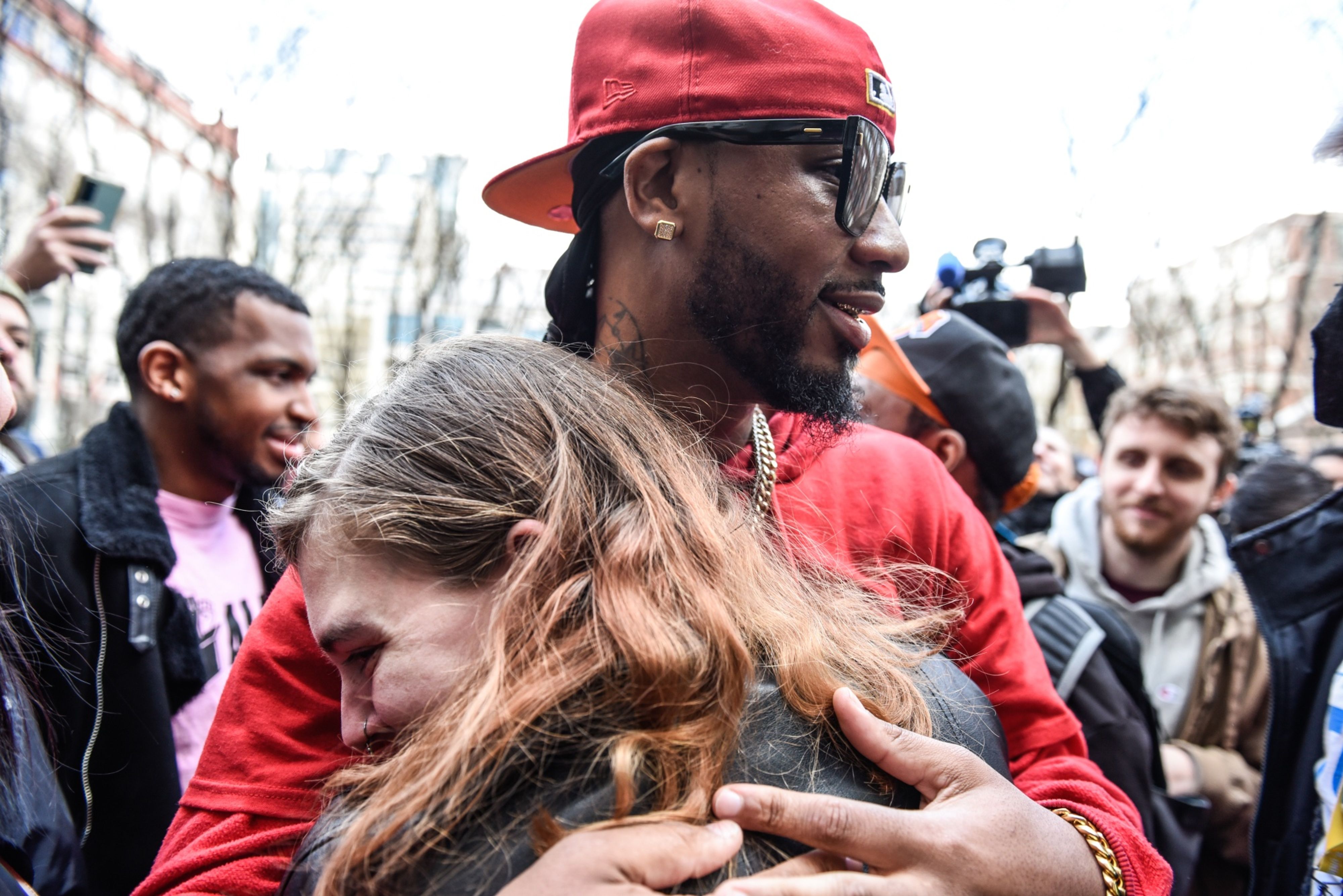 Amazon Labor Union founder Christian Smalls hugging a friend in celebration