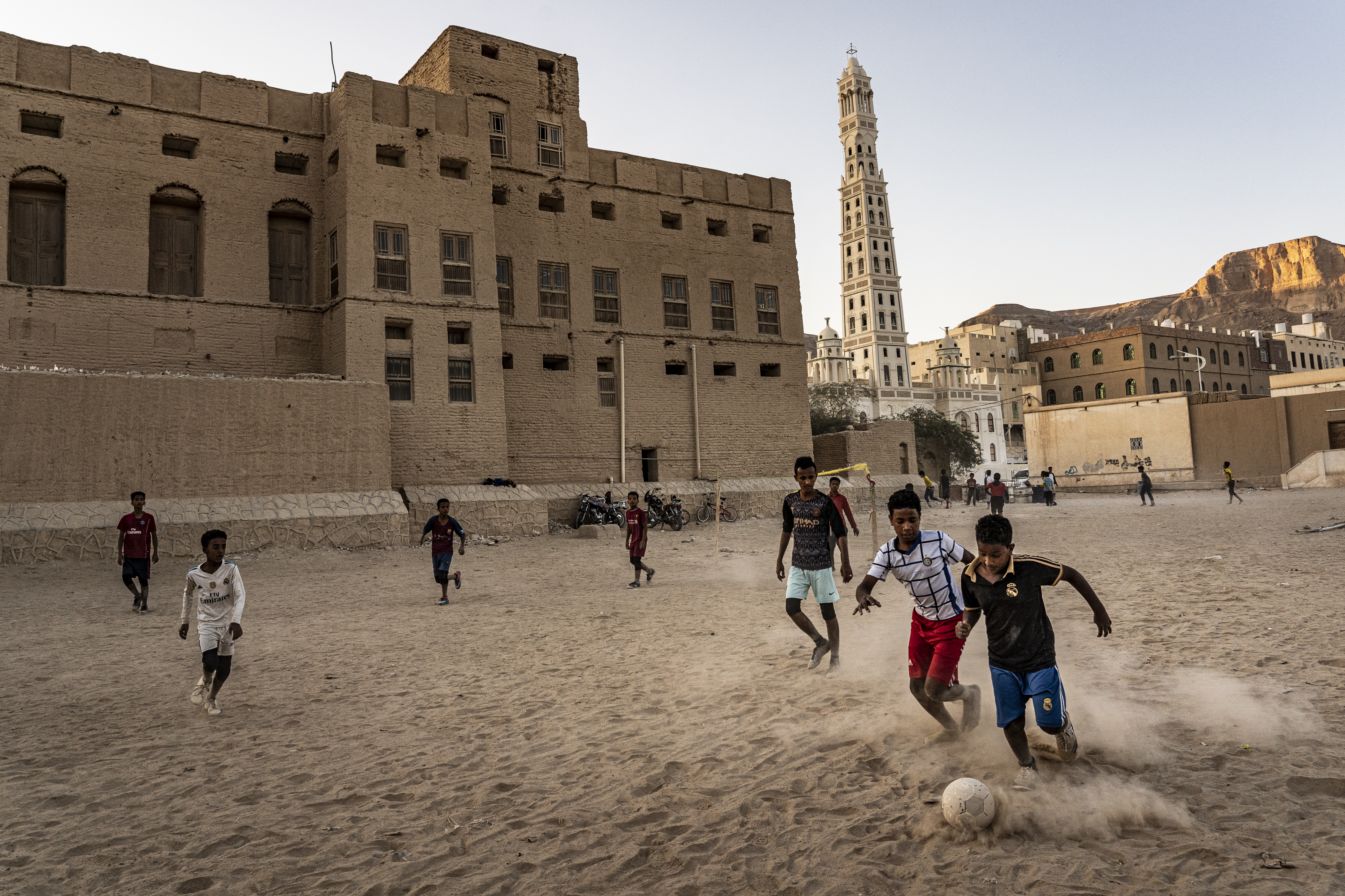 Boys play football at sunset in Tarim, Hadhramaut.