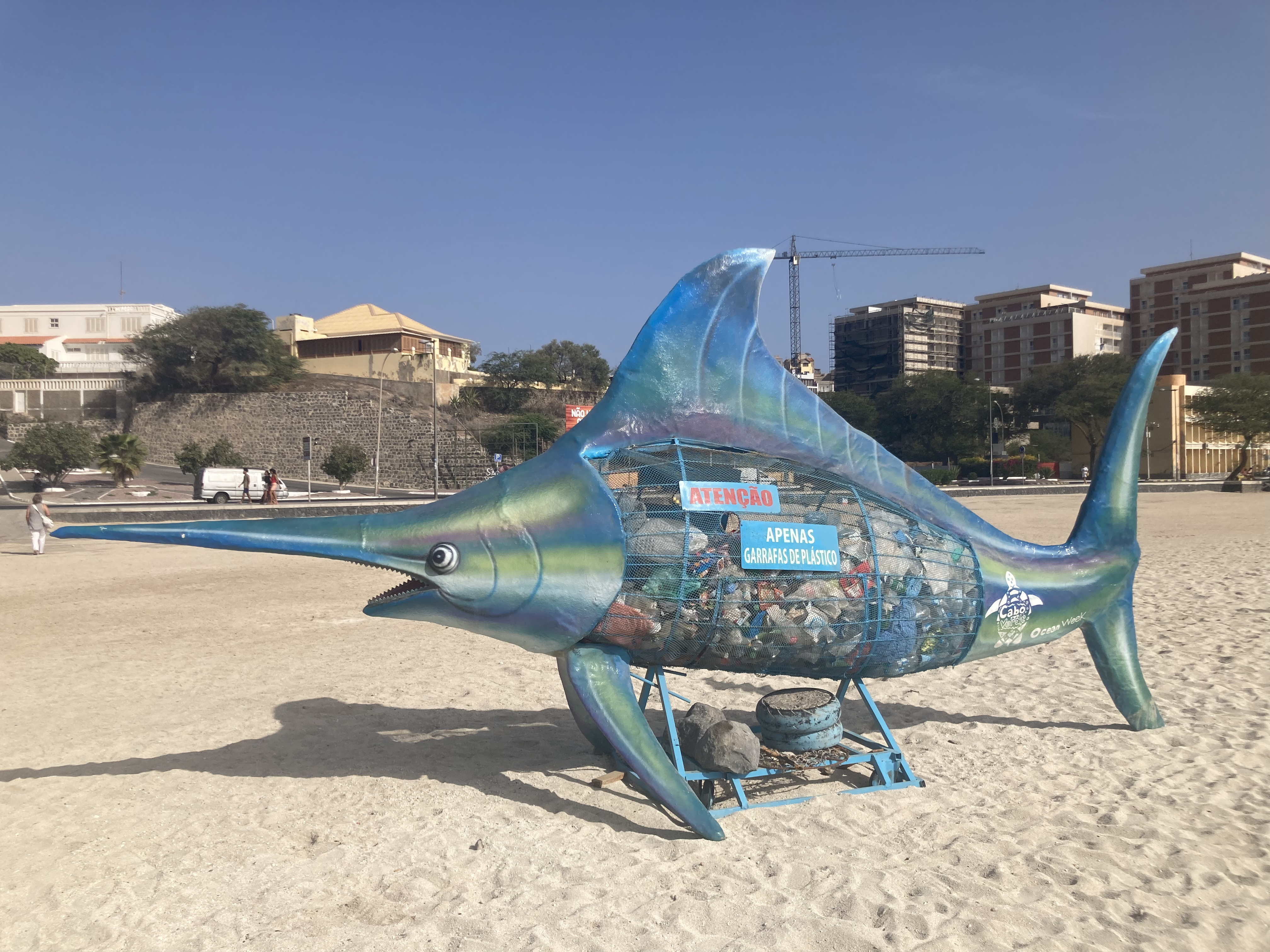 A trash can modeled after a marlin fish is seen on a beach in Mindelo, Cape Verde