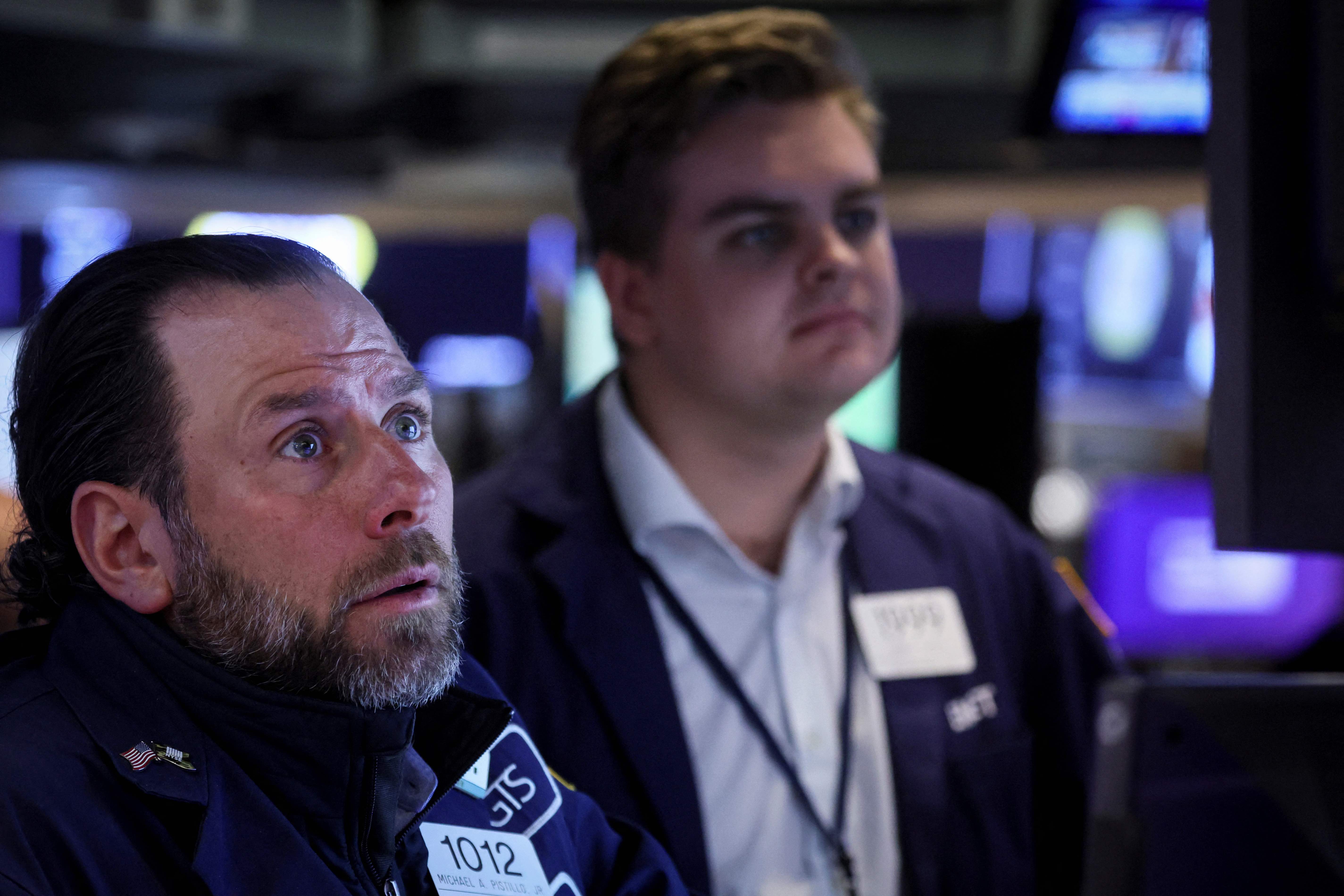 Traders work on the floor of the New York Stock Exchange (NYSE) in New York City, U.S.