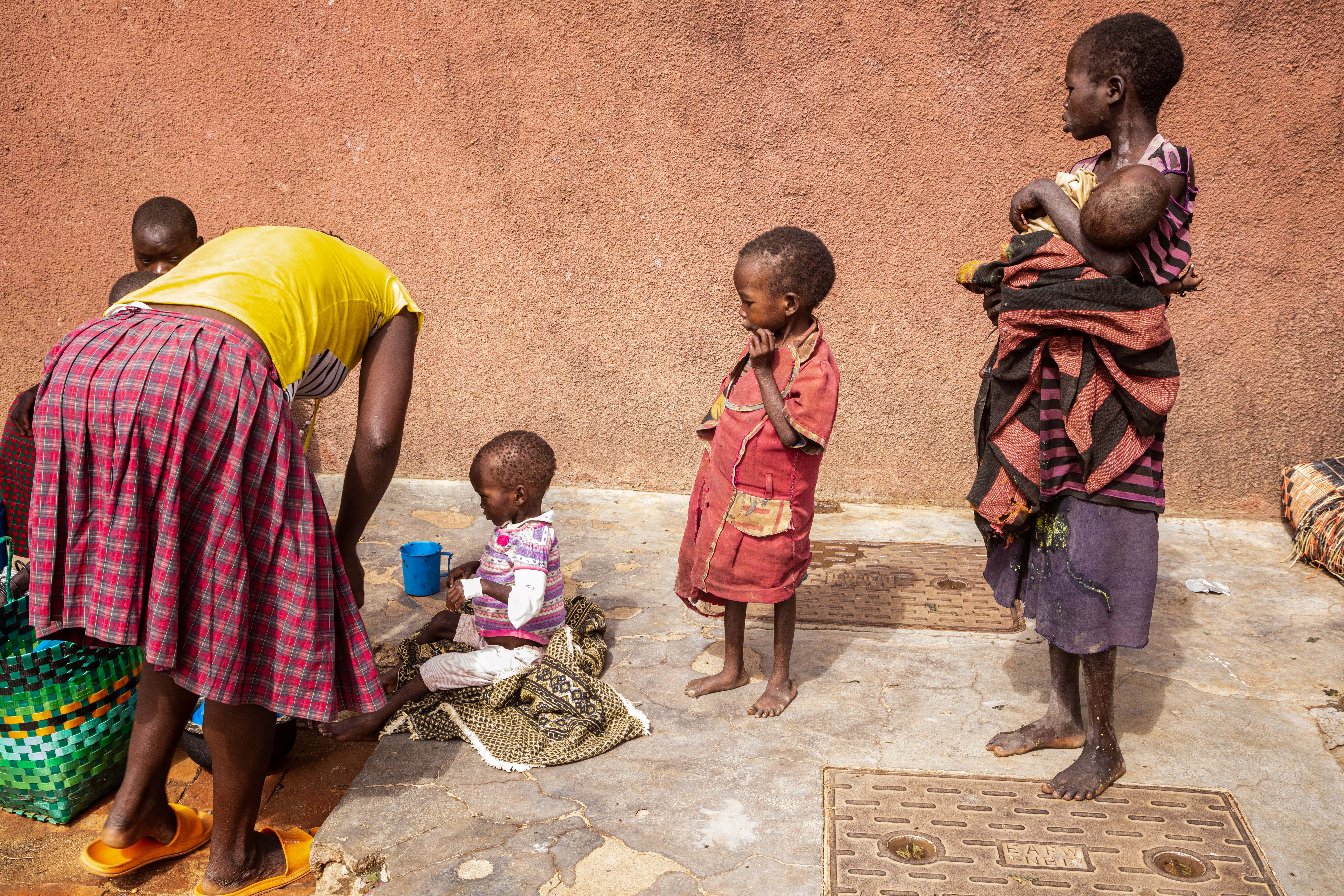 Mothers stay with malnourished children at Kaabong hospital in Kaabong, Karamoja region, Uganda
