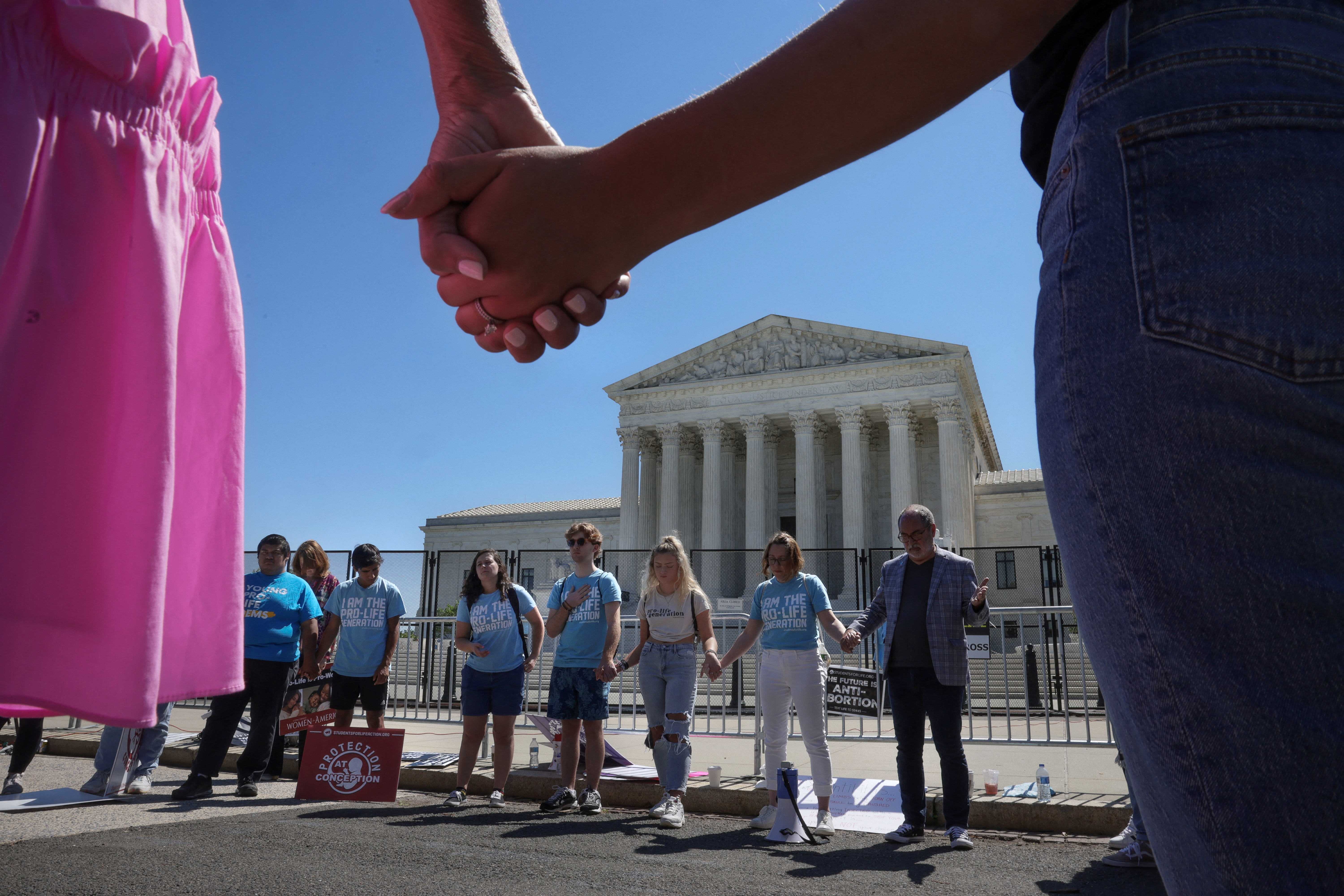 Anti-abortion rights protestors pray outside of the Supreme Court in Washington, DC.