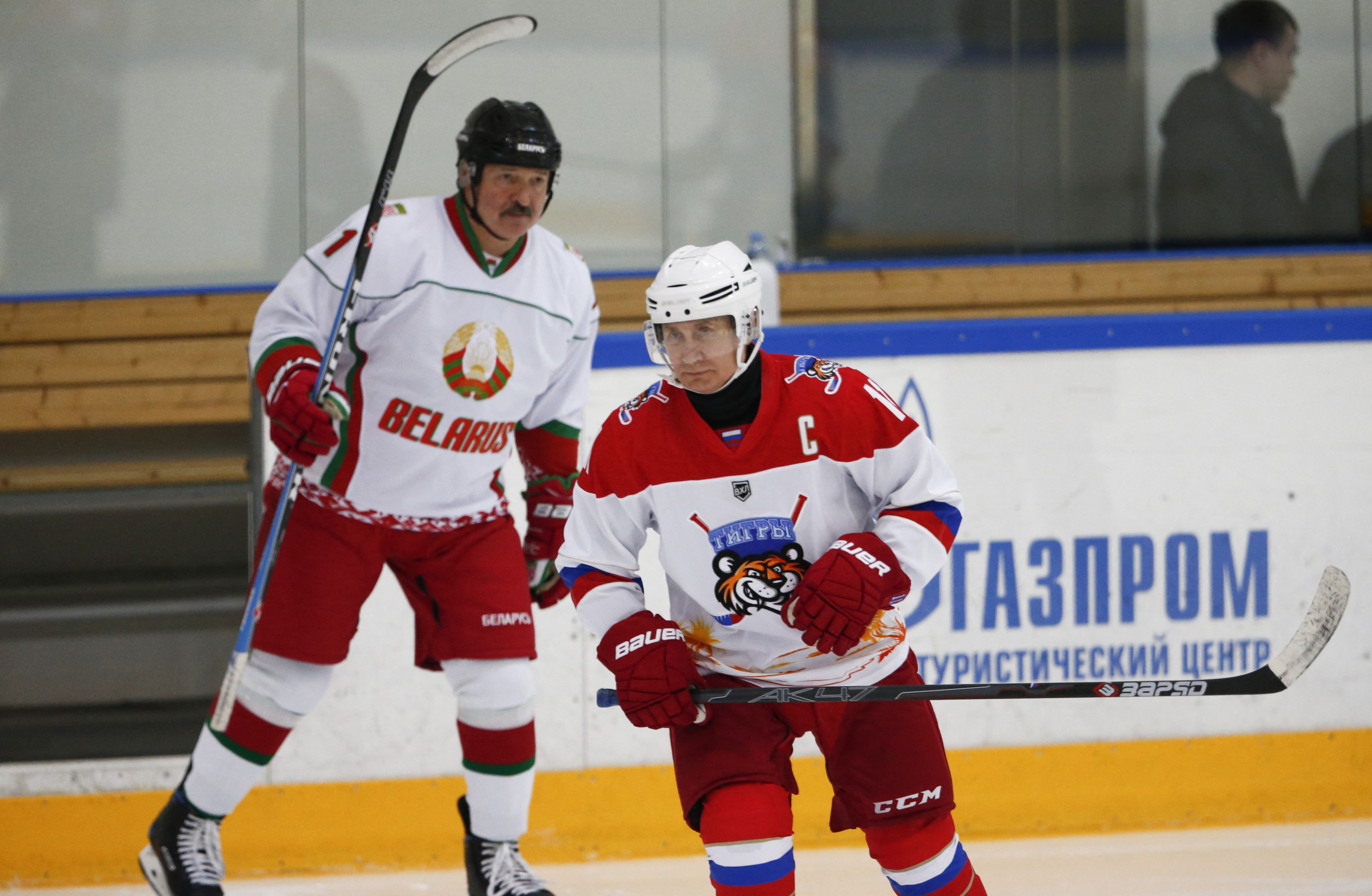 Russian President Vladimir Putin (R) and Belarusian President Alexander Lukashenko take part in an ice hockey match at Rosa Khutor outside the Black Sea resort of Sochi in 2020 [File: Alexander Zemlianichenko/Pool/ AFP]