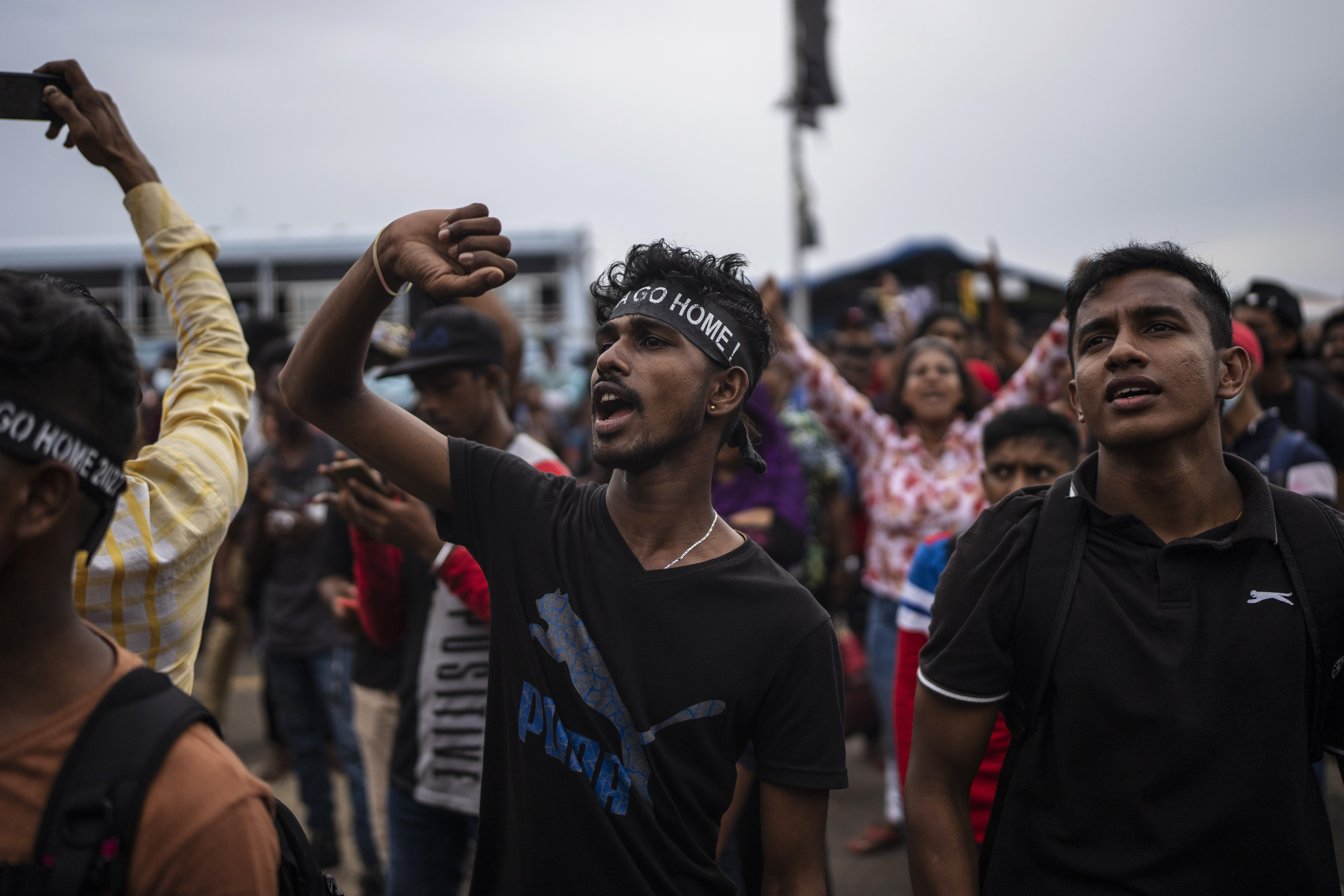 Protesters shout slogans at the protest site in Colombo, Sri Lanka, Monday, July 11, 2022.