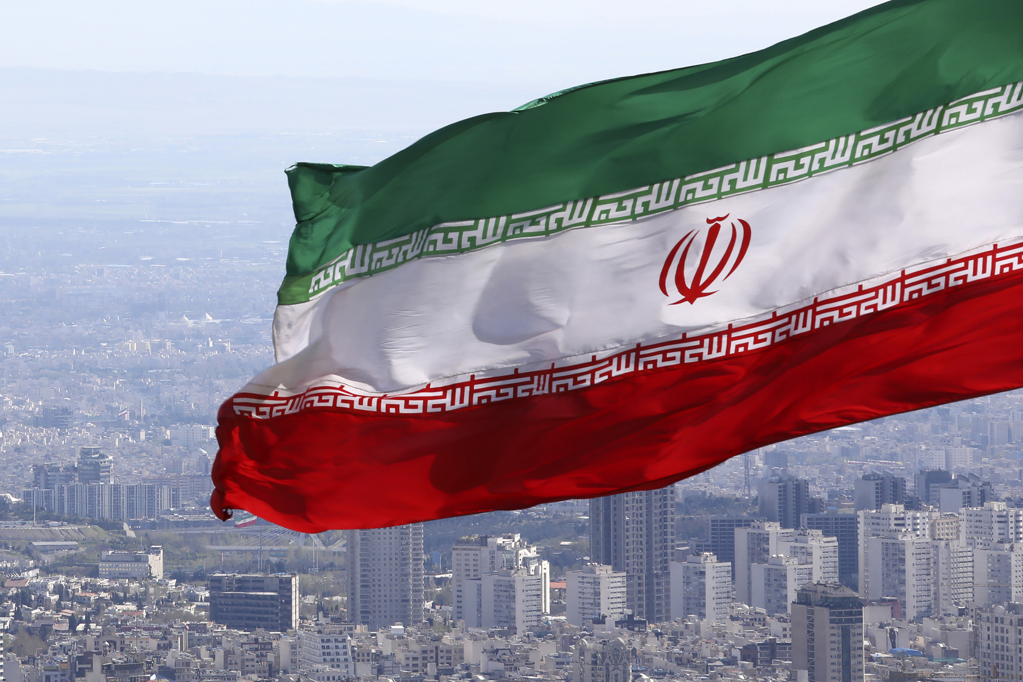 Iran's national flag waves in Tehran.
