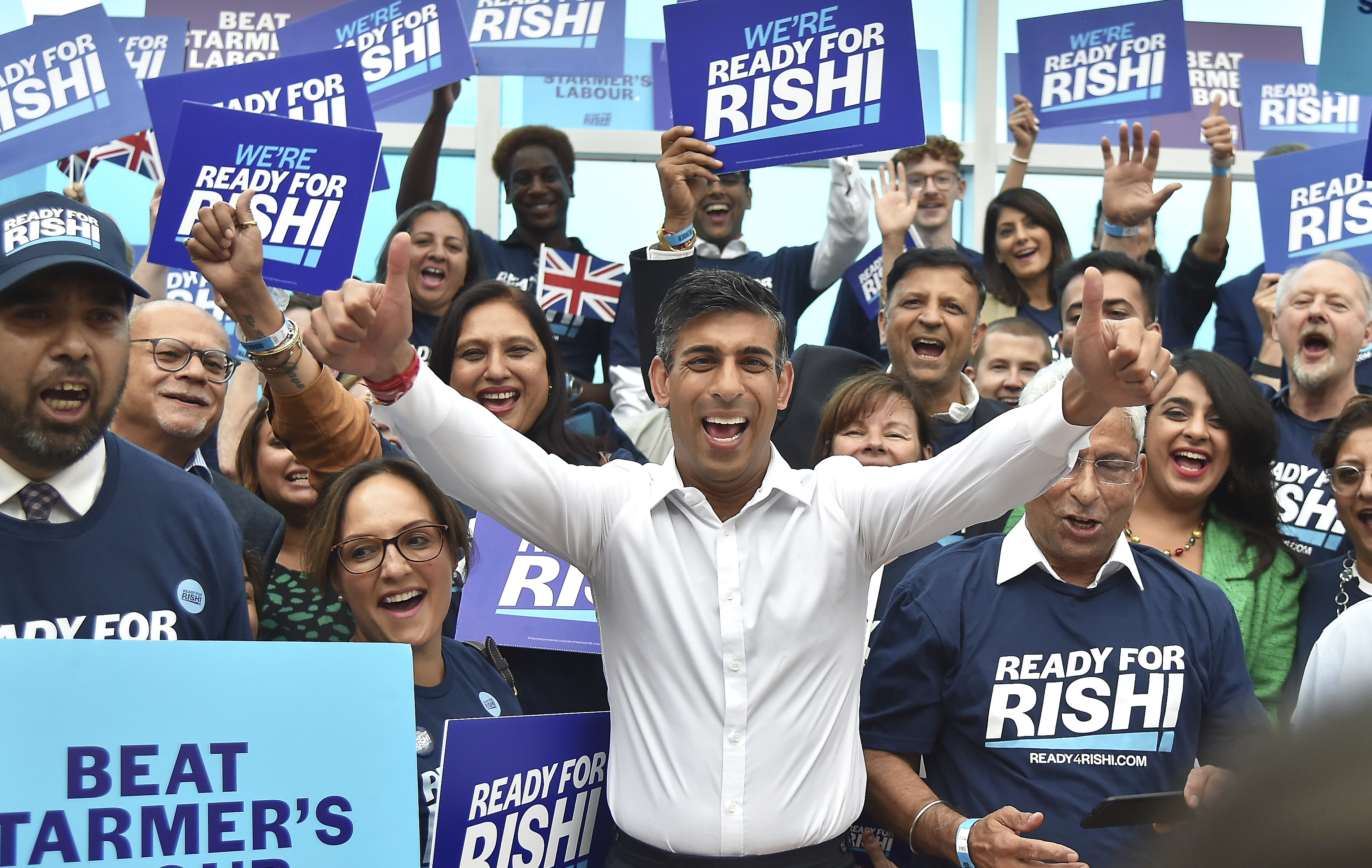 Rishi Sunak standing in front of supporters