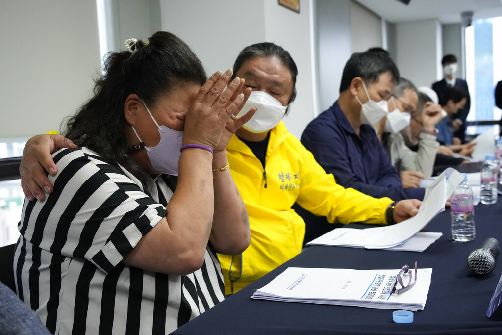 Park Sun-yi, left, a victim of Brothers Home, weeps during a news conference at the Truth and Reconciliation Commission office in Seoul