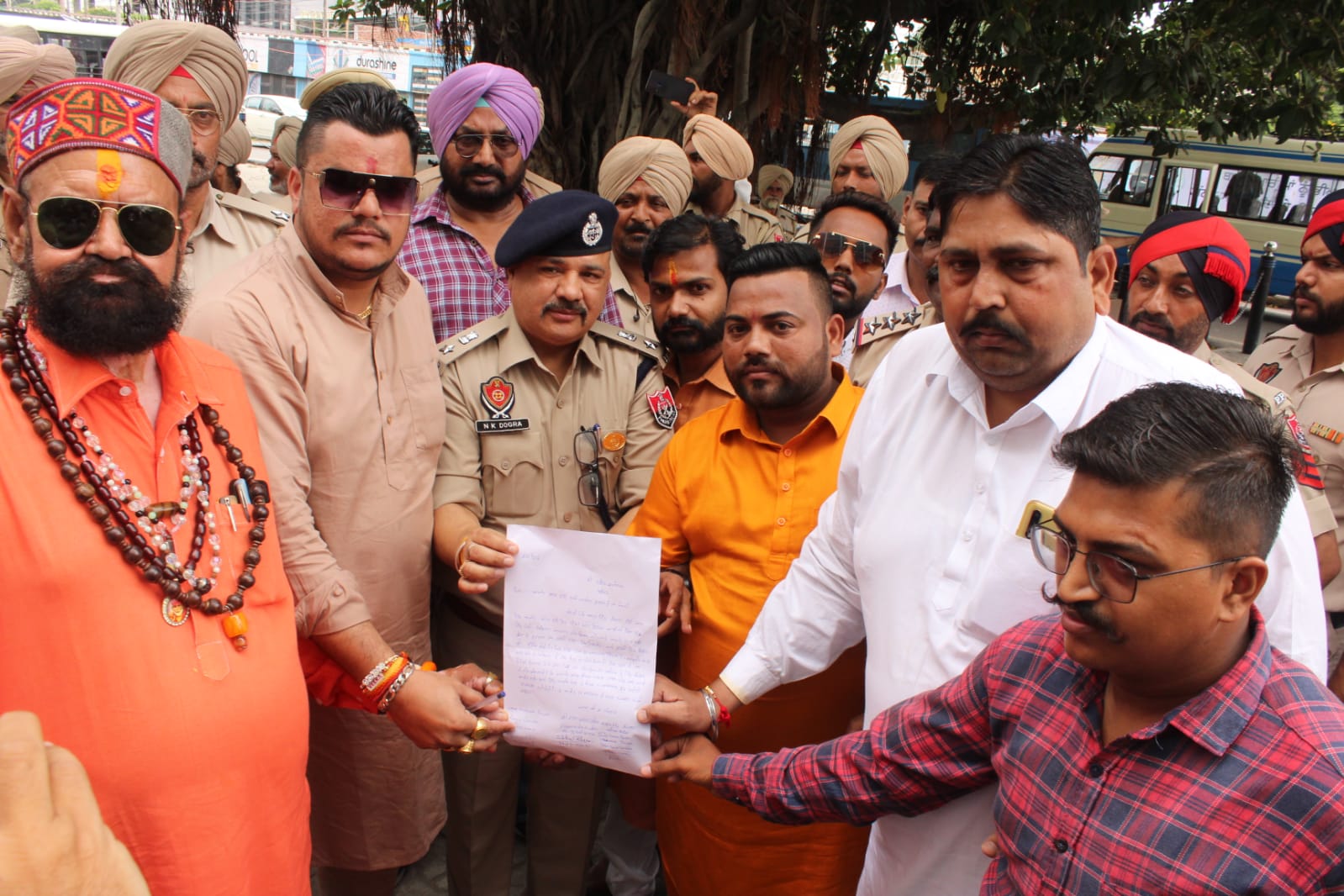 A Hindu group holds up a petition calling for the banning of Aamir Khan's new film