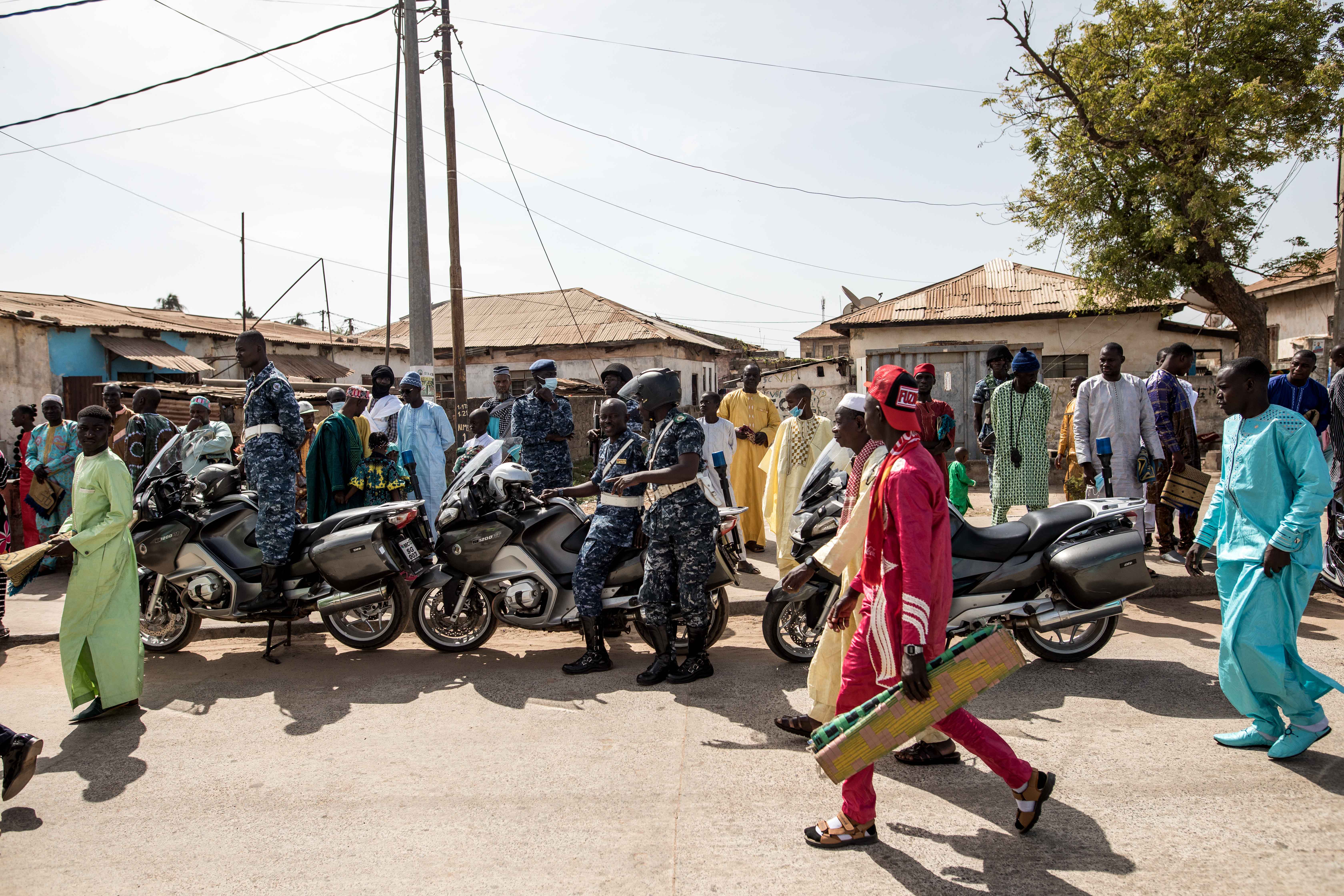 Worshippers arrive ahead of Eid al-Fitr prayers, marking the end of the Holy month of Ramadan, at the King Fahad Mosque in Banjul